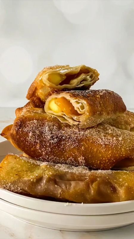 Get ready to take your peach cobbler obsession to the next level with these mouthwatering Peach Cobbler Egg Rolls!

Get the full recipe 👇🏼
- https://foodpluswords.com/peach-cobbler-egg-rolls/
- OR search “Food Plus Words Peach Cobbler Egg Rolls"

#LTKunder100 #LTKFind #LTKfitness