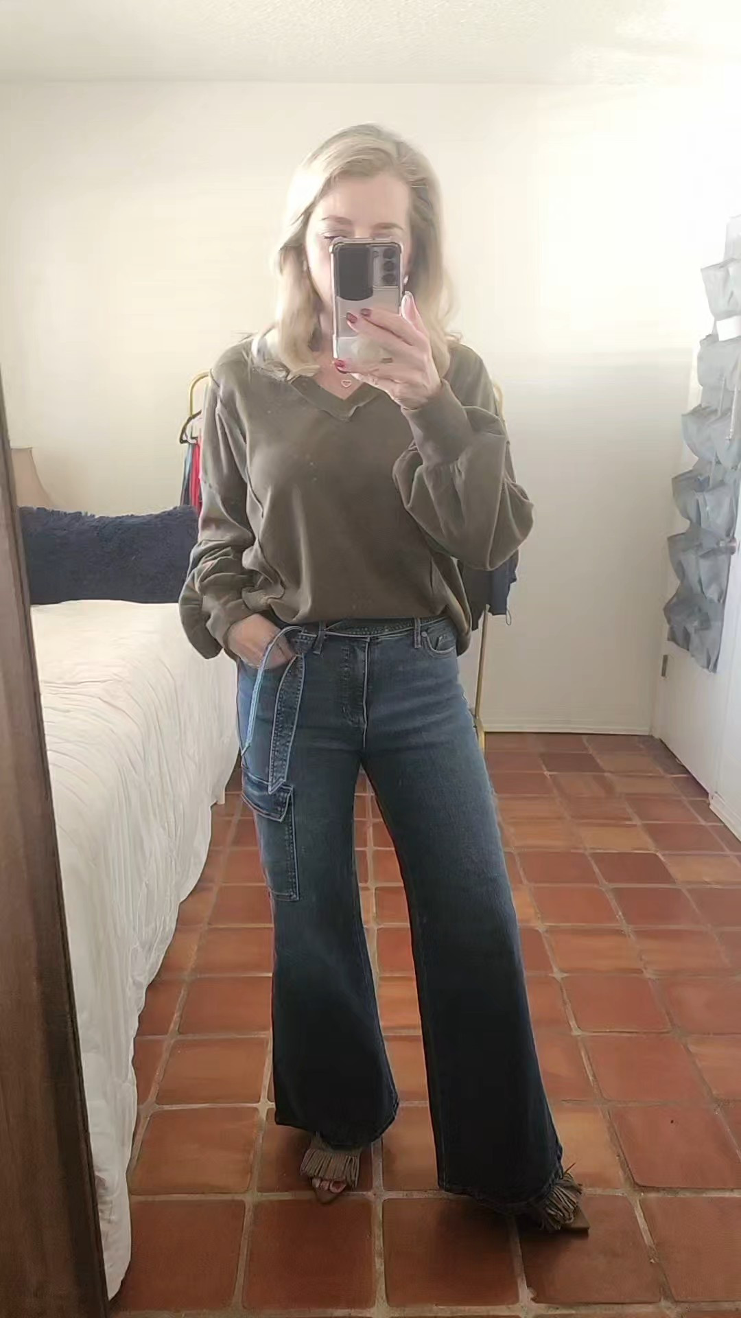 My #ootd.They brought these jeans back and so happy they did. They are a favorite of mine.The belt is removable. I did tts and there are 3 other washes. My top is also tts and comes in a ton of colors. A goid transition piece for spring.Jeans, casual looks, casual fashion, wide leg jeans, flares, pullovers, transition pieces, spring looks, spring 2026, date night, womens fashion, heels, slides, fringe, shoe lover, lip gloss, hair care, ootd, 

#LTKootd #LTKgrwm #LTKWorkwear