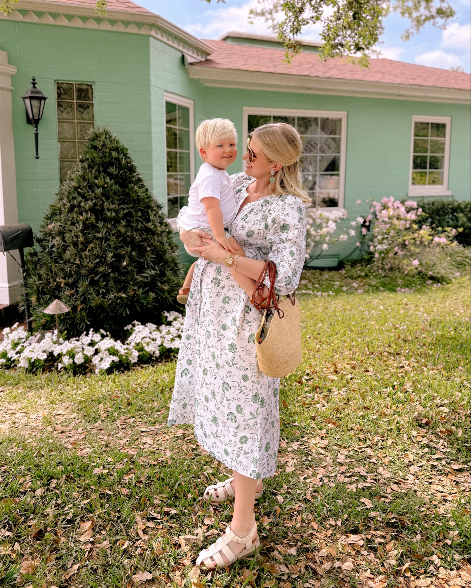 Toddler green and white striped shorts, white pocket t-shirt, and leather sandals. Women’s green and white floral dress wearing a size small (and very bump friendly!). Sezan woven tote and Dillard fisherman sandals. 

#LTKbump #LTKkids #LTKSeasonal