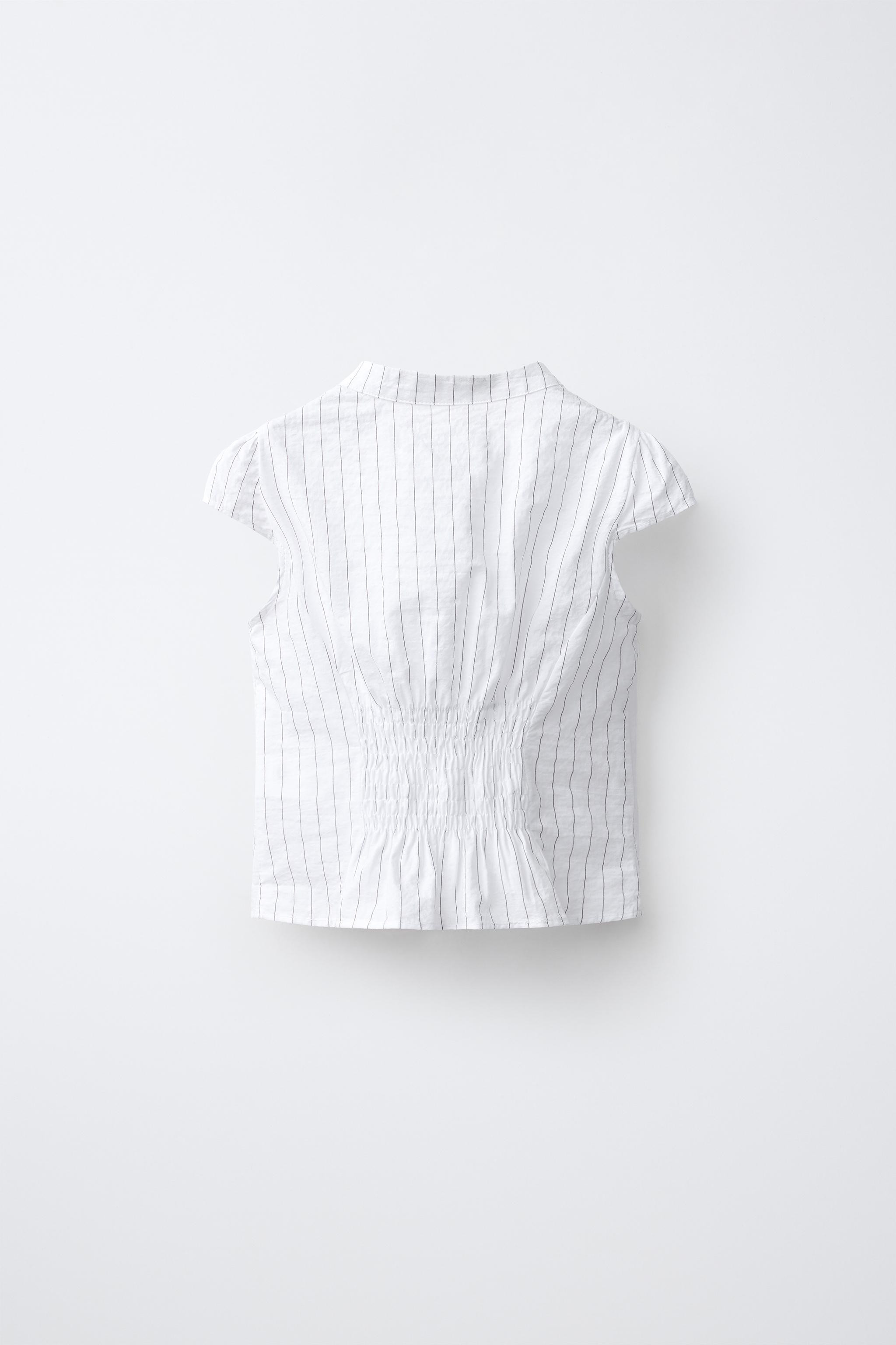 Mandarin collar shirt with short sleeves. Features a teardrop button front closure with frog fast... | Zara US