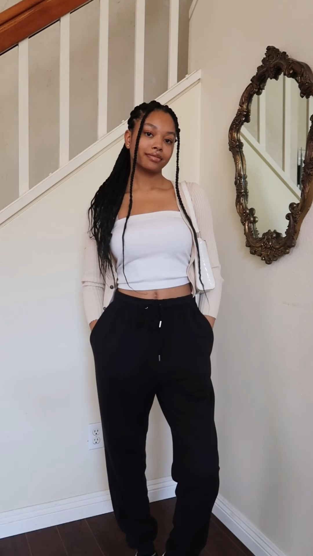 cropped cardigan, beige cardigan, white tube top, white crop top, black sweatpants, reebok shoes, black and white sneakers 

#LTKVideo #LTKstyletip #LTKfindsunder100
