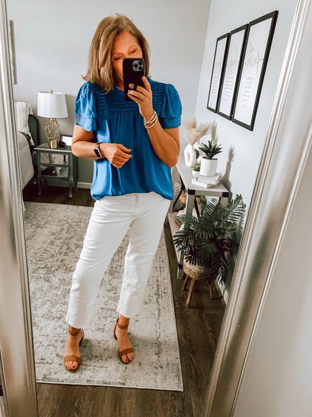 White girlfriend jeans on sale from Gap Factory, blue blouse on sale from Loft (runs slightly big) bought my normal size. Loving the color combo! Spring outfit, white jeans, transition outfit, sandals, Loft, business casual, date night, fashion over 40, casual outfit 

#LTKfindsunder50 #LTKsalealert #LTKstyletip