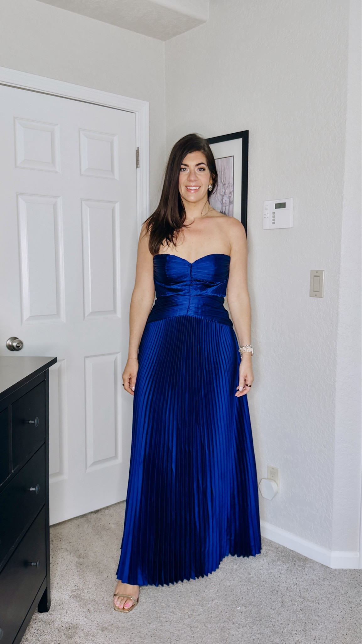 In a medium pleated dress 

#LTKWedding #LTKMidsize #LTKOver40