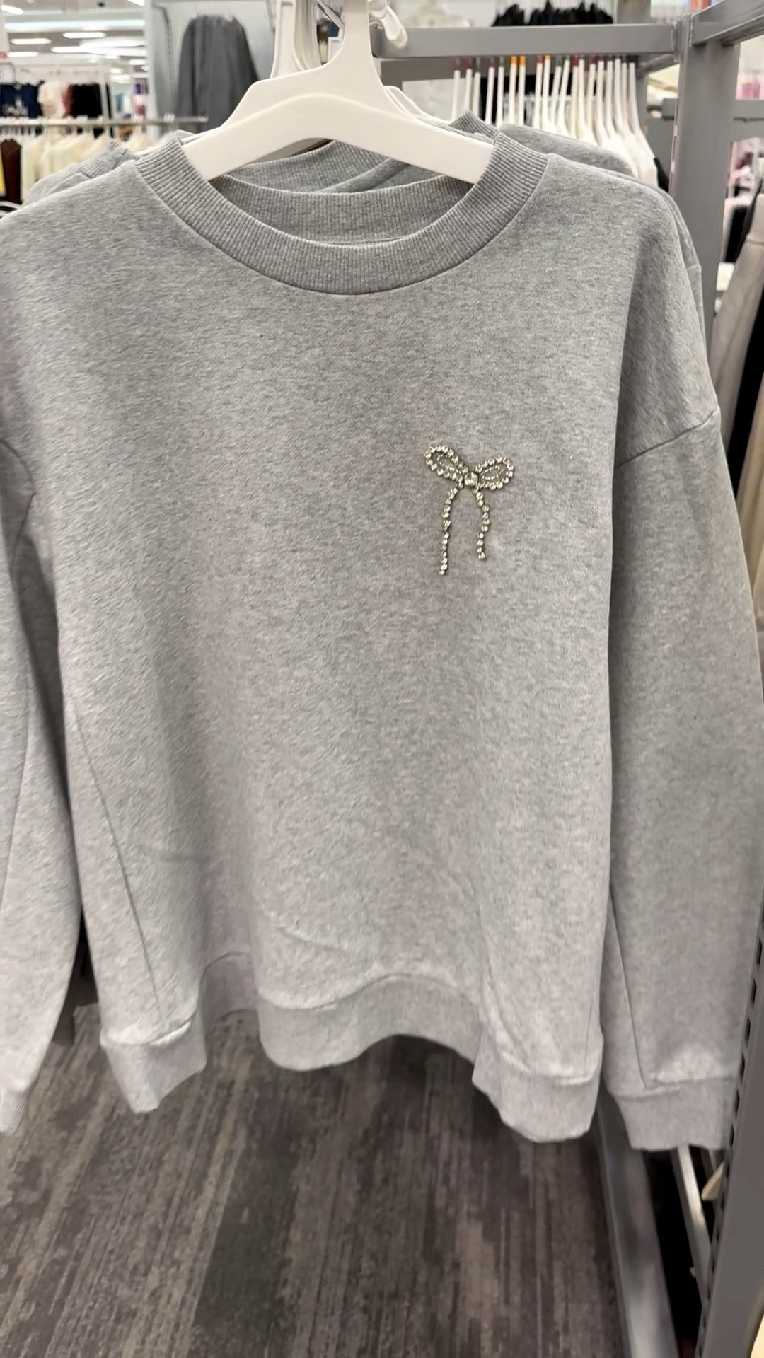 This sweatshirt is adorable, and perfect for a low-key NYE look! Wear it with jeans, dressy pants, or a skirt. Very flexible! It comes in two colors — this is the heathered gray — and has an adorable rhinestones bow. This is a warm one and has fleece lining, round neck and ribbed cuffs and hem.

#bowsweatshirt #dressysweatshirt #newyearseve #NYE #nyefit #nyetop #warmnyetop #bowdetail #target #anewday #rhinestonebow #newyearsevepartylook

#LTKFindsUnder50 #LTKSeasonal #LTKHoliday