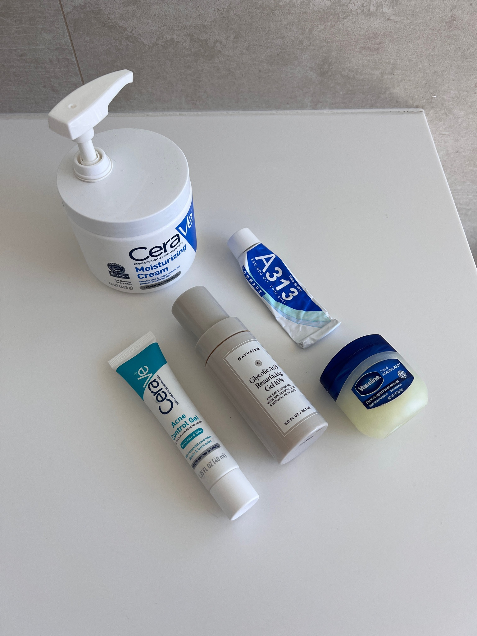 Travel friendly nighttime skin care routine: salicylic acid, glycolic acid, retinyl palmitate, moisturizer (shown is not travel sized - travel sized linked), and petroleum jelly (Vaseline) 

#LTKFitness #LTKBeauty #LTKTravel