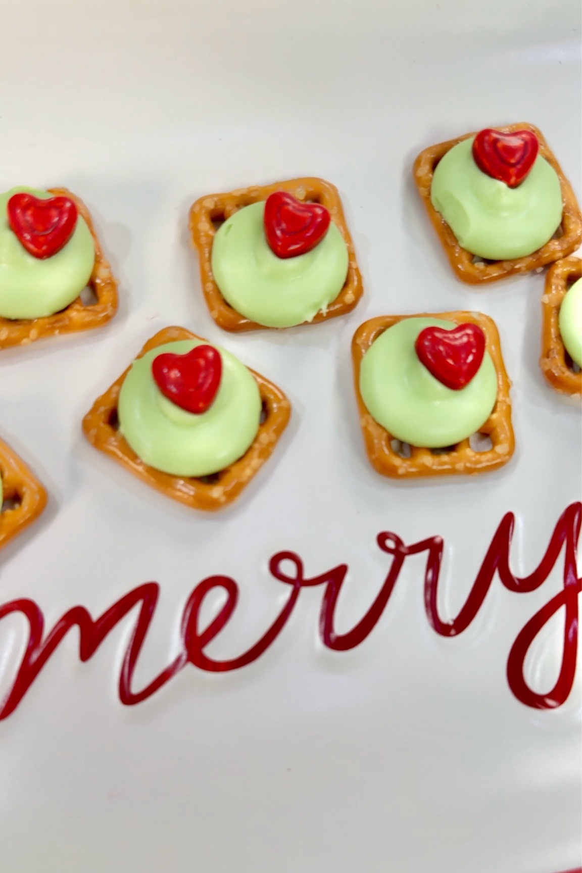 These Grinch pretzel bites are the cutest holiday treat! Just melt green candy melts on pretzel snaps at 200°F, then add a red candy heart to show the Grinch’s heart growing bigger. Sweet, salty, and so festive—perfect for holiday snacking or gifting! #GrinchTreats #HolidaySnacks #LTKHoliday #Grinchmas #HolidayTreats 

#LTKHoliday #LTKSeasonal #LTKFamily