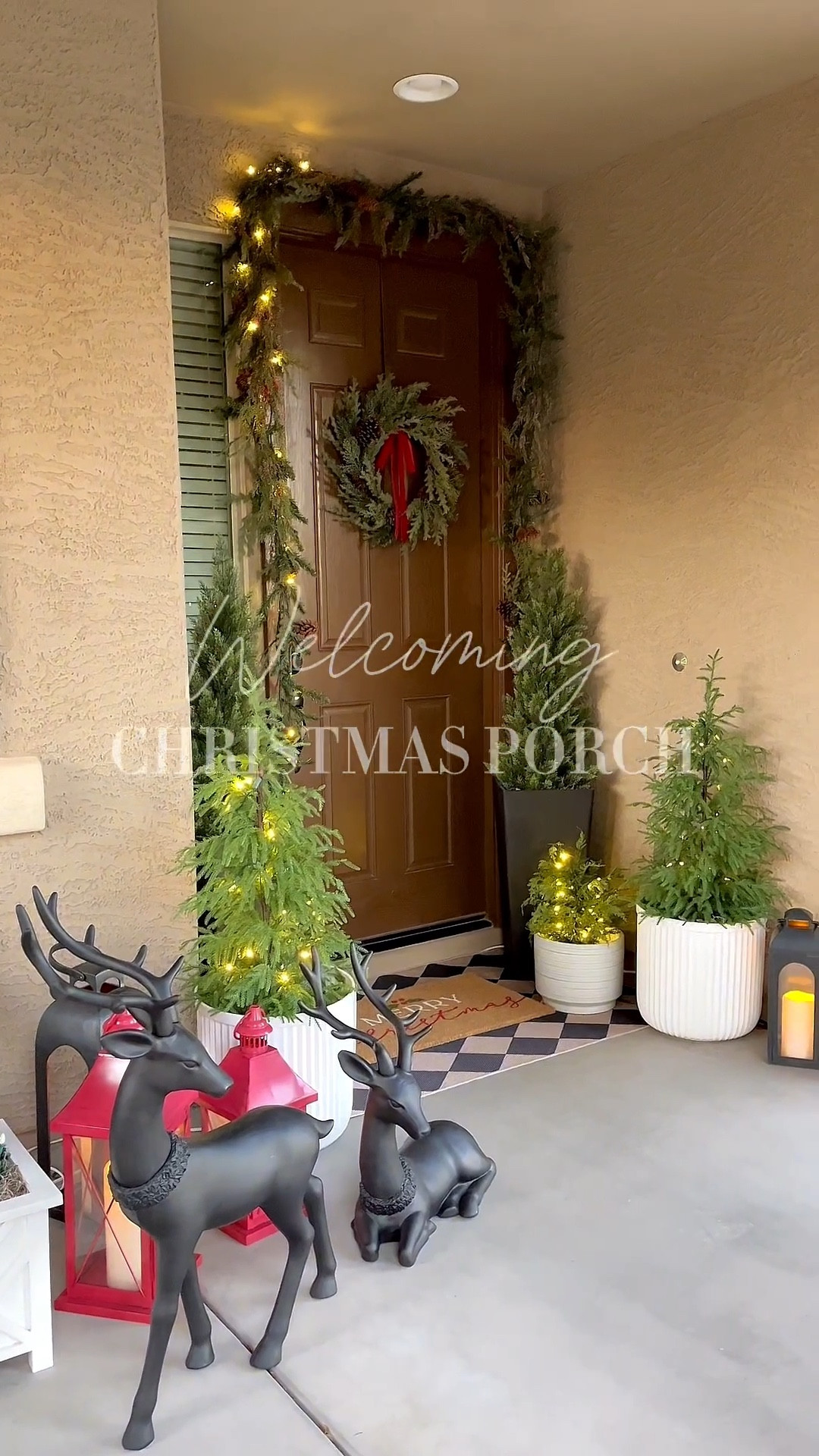 Welcoming Christmas porch!  Follow @lifeinmyarizonahome on Instagram for more holiday ideas and inspiration. 

I kept everything classic with garlands, lots of greenery, red velvet bows, and these beautiful matte black deer.  Twinkle lights keep it warm, cozy, and welcoming from the moment you walk up!

#christmasporch # holidayporch #christmasdecor 

#LTKHome #LTKHoliday #LTKSeasonal