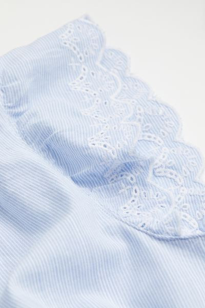 Blouse in an airy weave made from a cotton blend with a small, frilled collar and V-shaped openin... | H&M (US + CA)