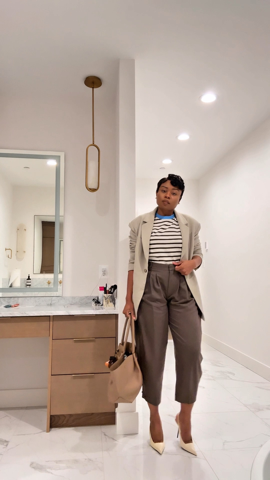 Spring work outfit inspiration - One of my favorite spring workwear formulas:

• Striped tee
• Pleated barrel leg pants
• Oversized blazer
• Classic pumps

Effortless, polished and easy to recreate for the office.

Save this for your next spring office outfit or business casual work look.

#springworkwear #workoutfitideas

#LTKWorkwear #LTKOver40