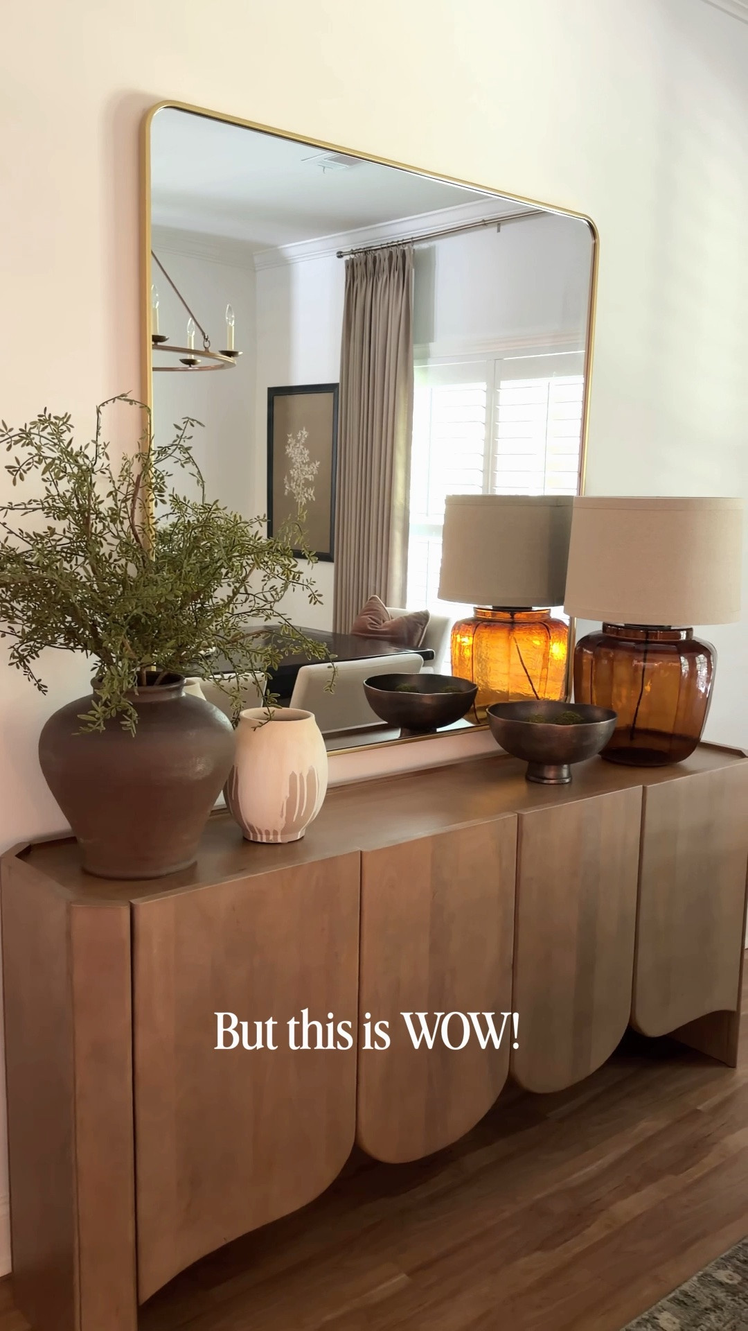 Your space deserves the right scale.

The first picture looked nice, but the mirror was simply too small for the space. When it comes to mirrors and artwork, scale is everything. Don’t be afraid to go bigger! A larger mirror or piece of art can make a room feel more spacious, balanced, and properly proportioned.

Choosing the right size creates a stronger focal point and helps your entire room feel more intentional and complete. Sometimes, bigger really is better!