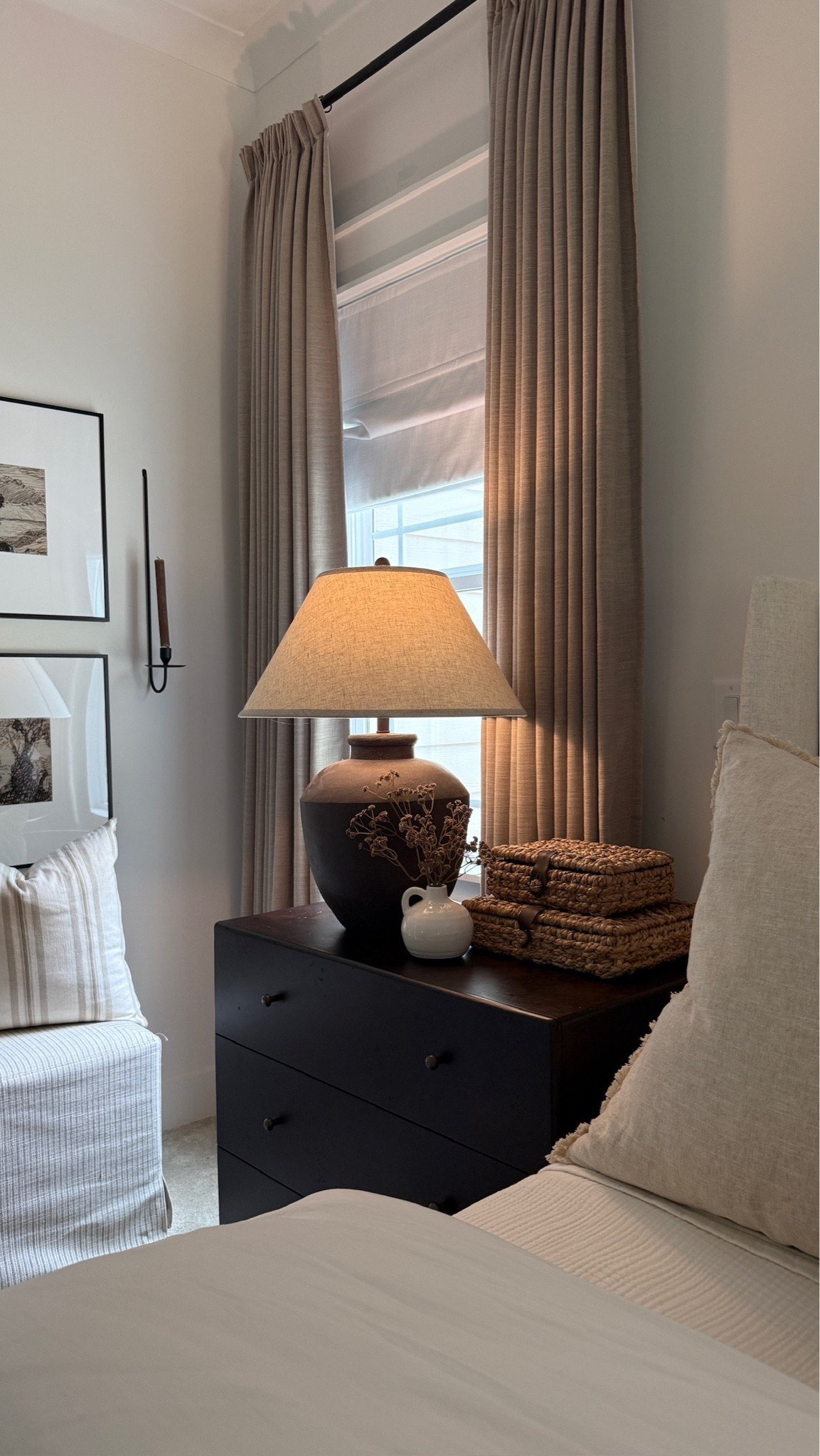A little moody corner in our primary bedroom that’s so classy. 🖤 I’m so glad we upgraded these nightstands, and those woven boxes are so elegant.

#LTKHome
