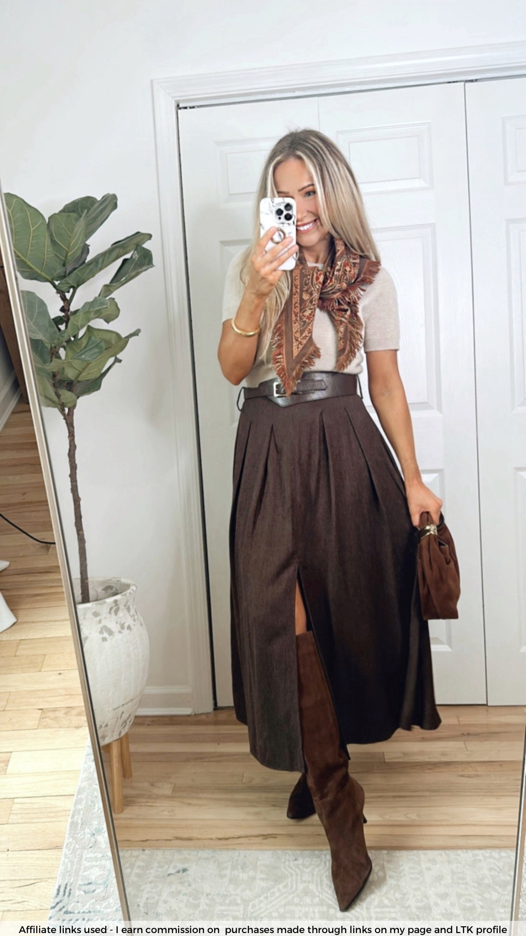 Early spring outfit

Zara brown skirt midi belted
Cashmere sweater tee
Zara scarf fringe 
Brown boots
Spring fashion
Chic style 