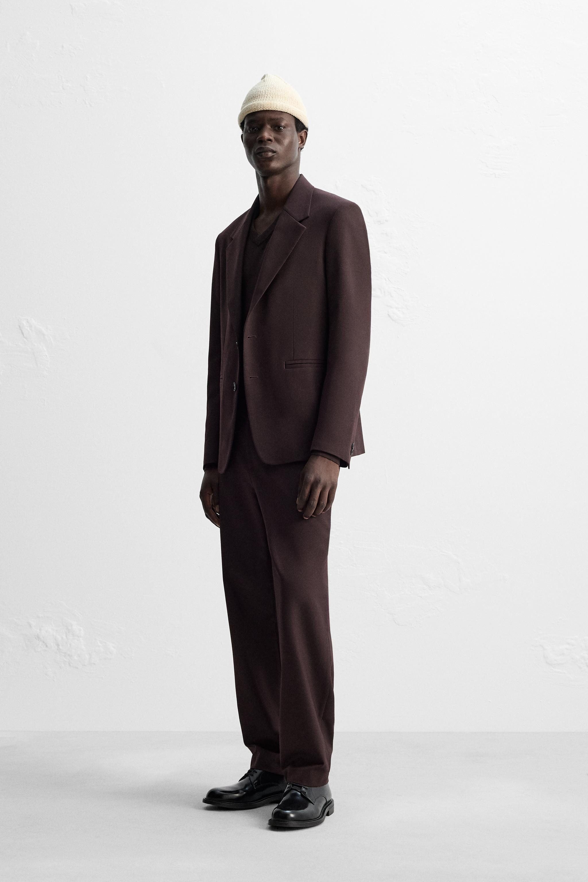 Regular fit blazer. Notched lapel collar and long sleeves with buttoned cuffs. Double welt pocket... | Zara US