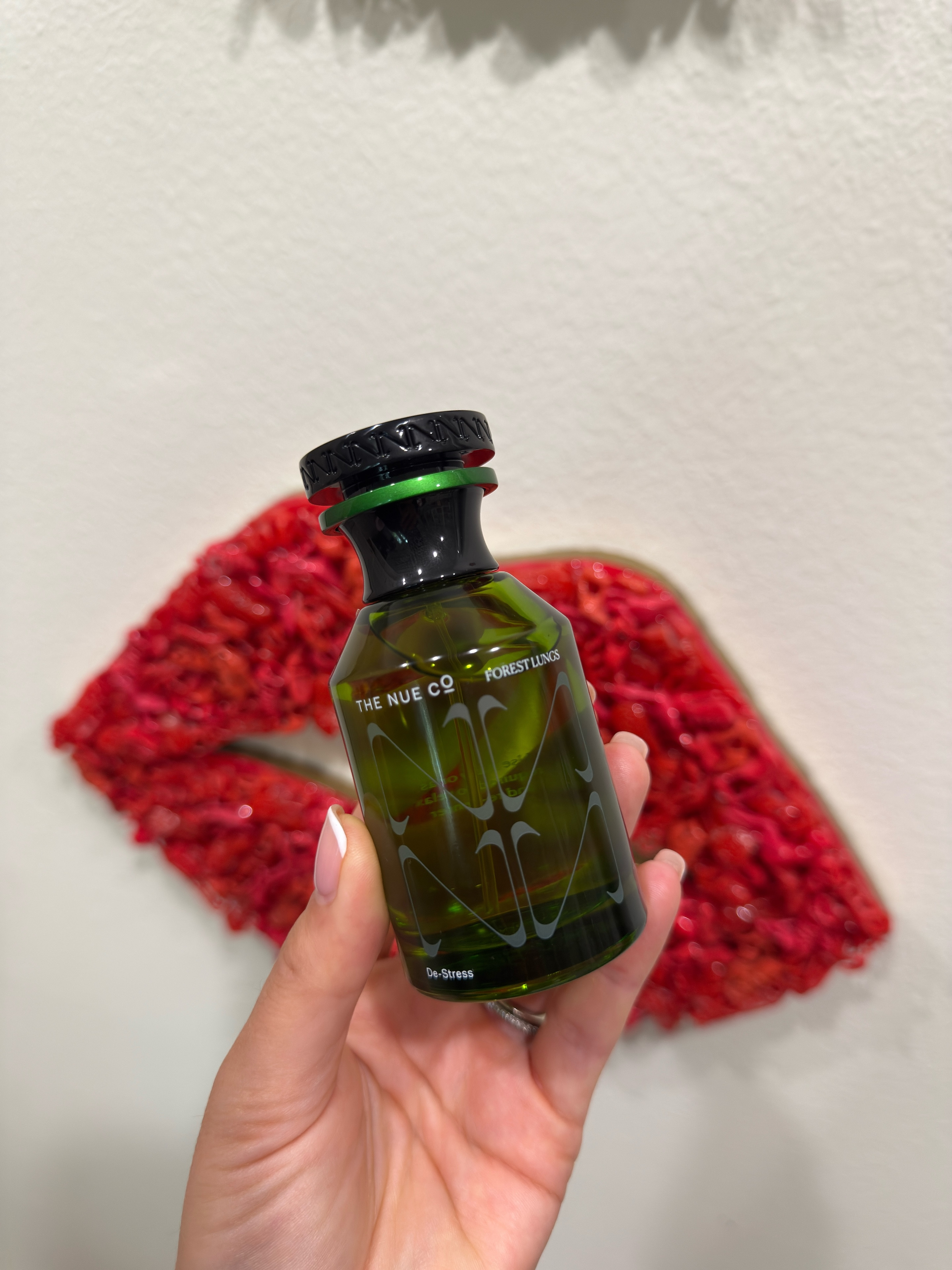 Perfume that actually does something — that's the pitch for The Nue Co.'s Forest Lungs De-Stress, and it's not as out there as it sounds.It's a fragrance supplement, meaning the blend is designed to work with your nervous system, not just smell good on your wrist. The scent is woody, smoky, a little aromatic — think a walk through trees after rain, not a department store floral. Clean ingredients, vegan, cruelty-free, and the packaging won't make you feel guilty about buying it.At $125 for the 1.69 oz, you're paying for the formulation and the intention behind it. This isn't a blind buy fragrance — it's for the woman who already thinks about what she puts on her body and wants her perfume to be part of that same conversation.Honest note: scent is personal, and "woody and smoky" isn't for everyone. If your usual go-to is something light and fresh, this will be a shift. But if you've been looking for something that feels more grounded than pretty, this is worth trying. 

 