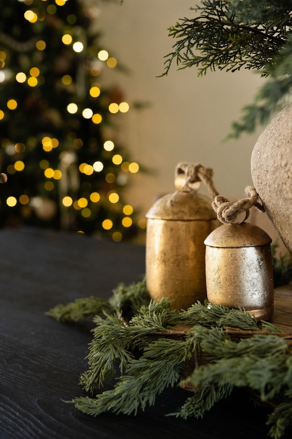 A soft little Christmas glow 🤍🎄 Loving these gold affordable Amazon holiday bells (I have them all over my home!), textured greenery, and that warm tree bokeh in the background. Perfect inspo for neutral Christmas decorating, modern classic holiday decor, Christmas centerpiece ideas, LTK holiday home finds, and cozy winter styling. 🔔 

#LTKHoliday #LTKSeasonal #LTKHome