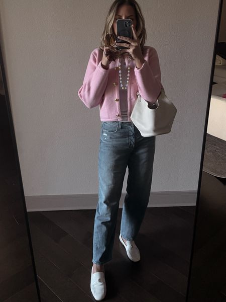 Pink cardigan with barrel jeans and white loafers 
