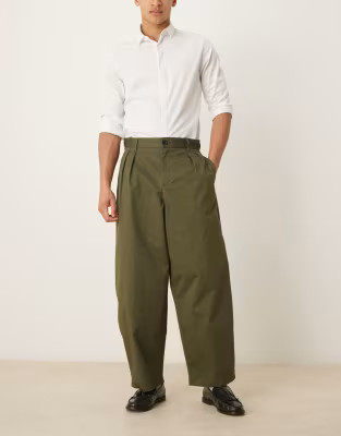 ASOS DESIGN extreme tapered pants with pleats in khaki green | ASOS (Global)