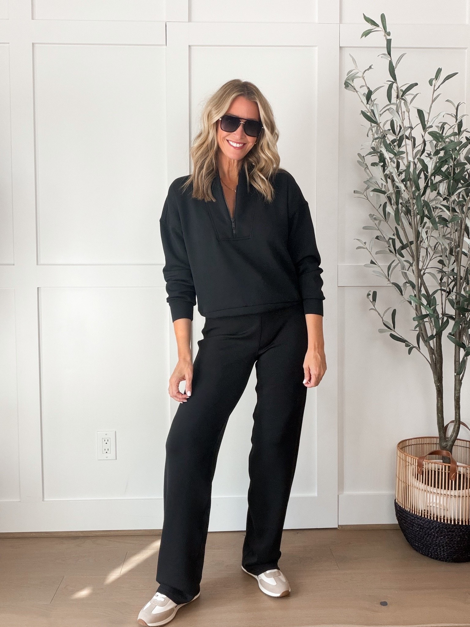 This black SPANX matching set is exactly what I want for travel days when comfort matters but I still want to look put together. The half zip pullover and straight leg pants have a relaxed fit, and I love that I can wear each piece separately with other basics in my closet.
New to SPANX? Use code HAUTEANDHUMIDXSPANX for 15% off your first order!
SPANX matching set, SPANX AirEssentials, black matching set, SPANX discount code, half zip pullover, straight leg pants, airport outfit, comfortable travel outfit, black lounge set, elevated athleisure, fall travel outfit, HauteandHumid