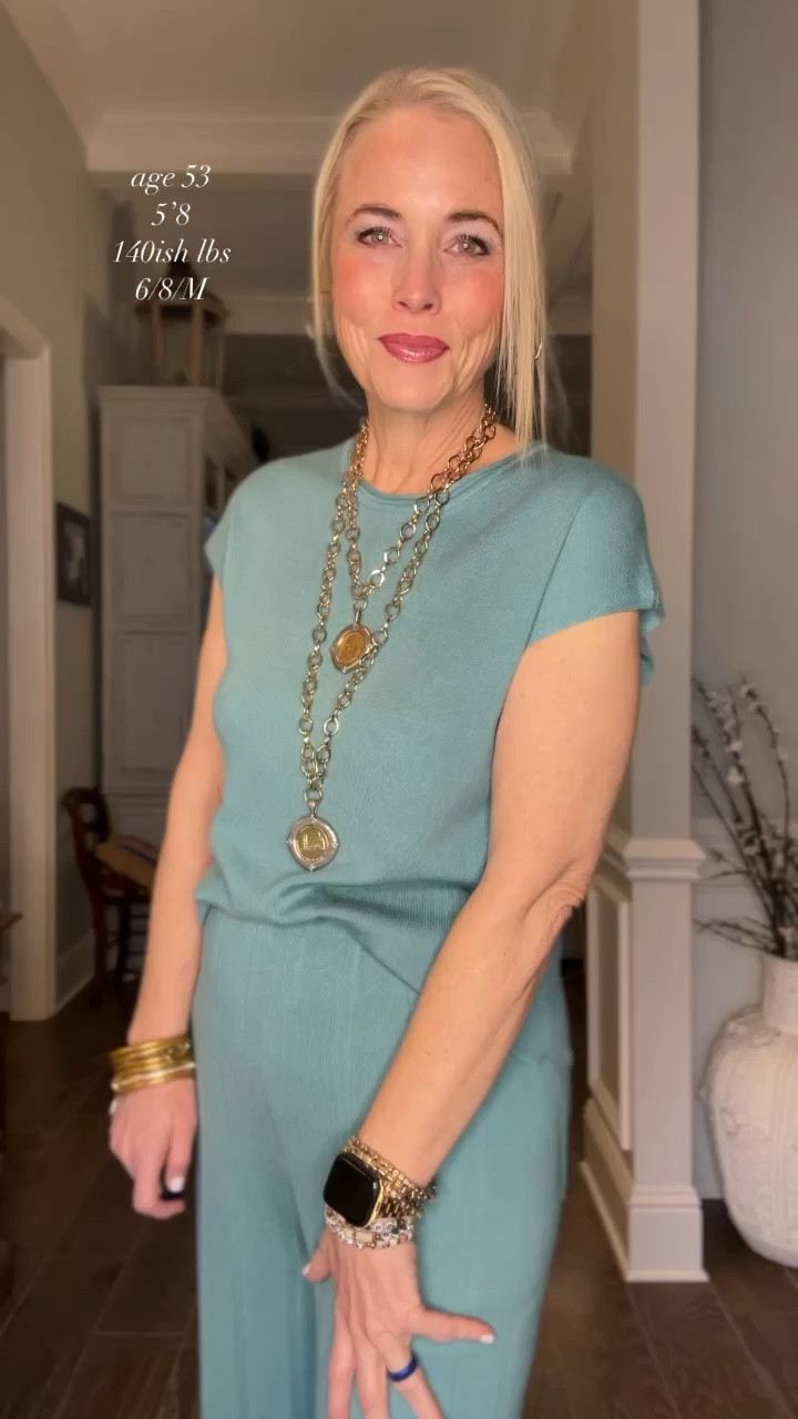 Merokeety hit it out of the park again with this short-girl-friendly lake blue 2 piece crewneck, short sleeve lounge set! The pants are wide leg with a comfy elastic waistband (can be easily rolled if you are a bit shorter and tugged down a bit below your waist if you’re taller) and pairs perfectly with this winter white coatigan for a long day of teaching.  I paired it today with pair of Dolce Vita-inspired look for less platform slip on sneakers from Target!  Of course I’m wearing my everyday gold and pewter jewelry to finish off the look. 

It is available in S-XL (US 4-18) and 12 colors (including pastels) that will very easily take you into spring and summer. This set would be perfect for vacation and travel and the pieces can mix and match with other things. If you are more of a pear shape, I would recommend sizing up one. 

Plus today the set is 10% off the coatigan is only $27.99 (regularly $46.99)!  

I am unable to link the gorgeous hand-crafted Jennifer Ponson Italian Treasures Coin jewelry, but I do have a link and discount code if you’d like me to send it your way  

#LTKsalealert #LTKmidsize #LTKover40