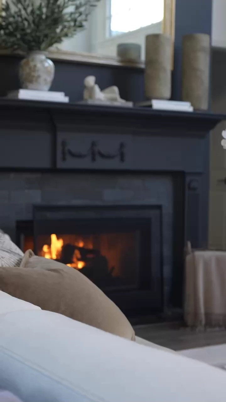 EEEK this is exactly how I love easing into spring. A cozy night on the couch with a book, candlelight glowing, and those soft pops of blue on the coffee table making the whole room feel refreshed. The stacked design books and classic decor keep it warm and layered while the blue accents bring that little hint of spring I’ve been craving!!! Ugh I am obsessed!  

 #LTKdayinmylife #LTKSeasonal #LTKHome