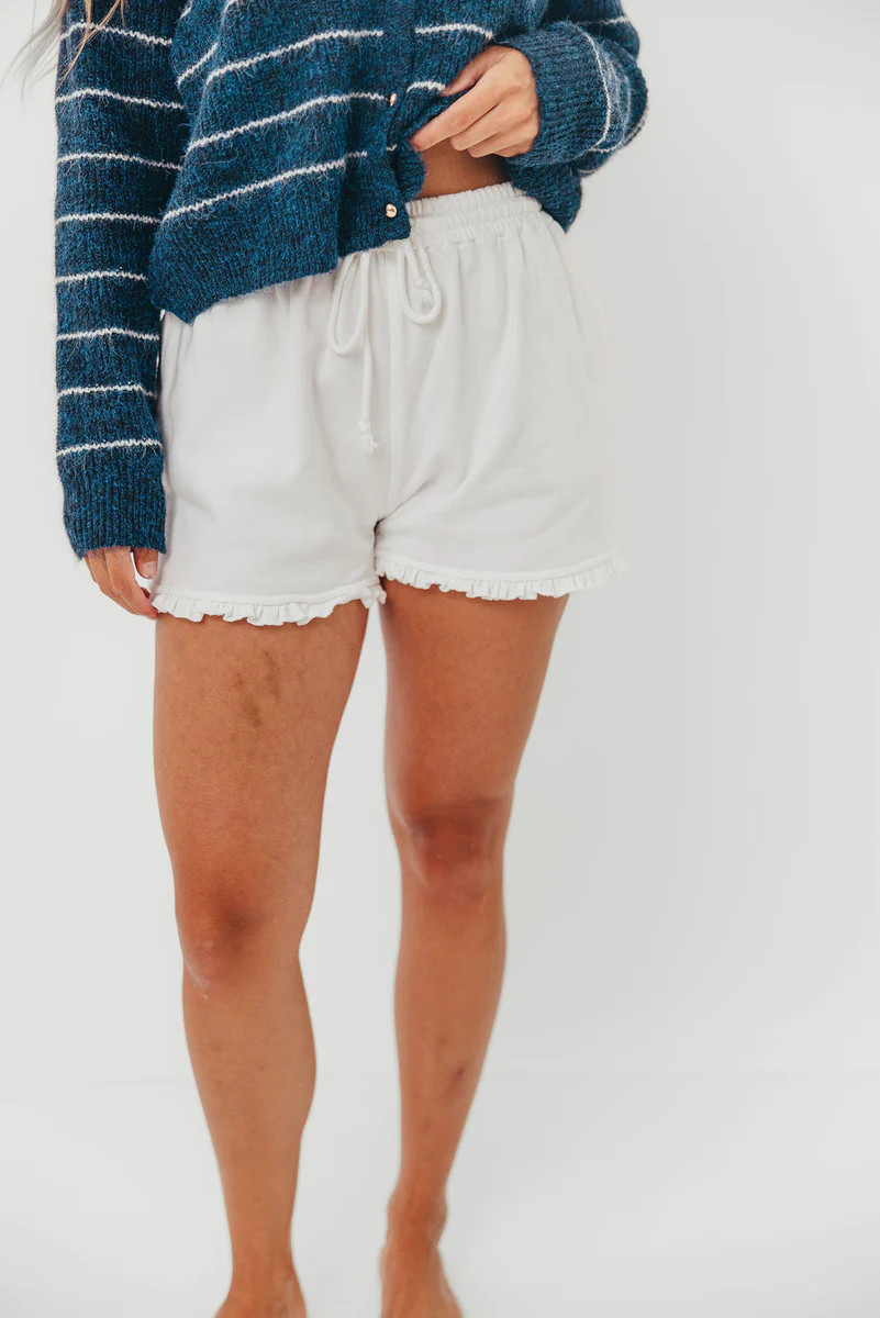 Trevi Ruffle Hem Knit Shorts in White | Worth Collective