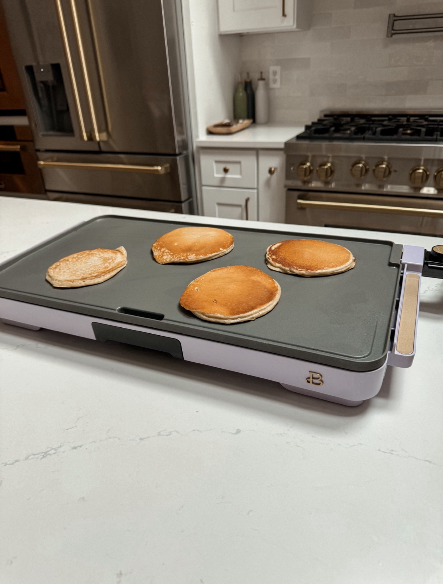 We got the new Beautiful by Drew Barrymore griddle from @walmart and it makes the most golden perfect pancakes!! #WalmartPartner It comes in tons of cute colors, obsessed with the purple 😍 #WalmartHome 

#LTKSaleAlert #LTKHome #LTKFamily