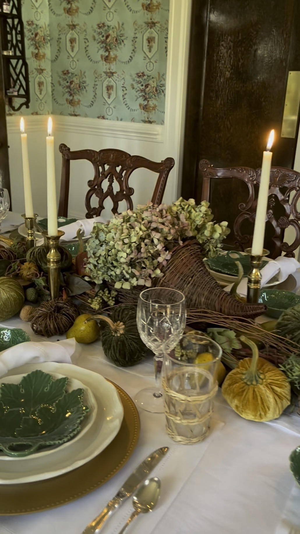 Ready to transform your dining table into a story-filled gathering spot? 🍂 A beautifully designed tablescape can take your guests to a whole new place, and it all starts with the right details! 🍂🌾

Here’s one of my favorite autumn tables from a few years ago. I built the look with two twig swags as the base, added a wicker cornucopia filled with dried hydrangeas, and kept the conversation flowing with low-profile decor. 🍂🌾 Rich autumn tones—deep browns, forest greens, golden hues, and pops of crimson—set the mood, while brass candlesticks, velvet pumpkins, dried fruits, and gold pheasants pulled everything together. 🕯️🍁 Green and white dinnerware paired with crystal and rattan glassware completed the timeless look. 🍂🌾

Gathering around the table with loved ones is one of life’s simplest joys, where memories are made and love grows. I hope this cozy setup inspires your next gathering! What’s your favorite element of fall tablescapes? 🍂🌾🐿️

Continuing to keep those who have been affected by Hurricanes Helene and Milton in my thoughts and prayers. 🙏🏻

#autumntablescape #cozyfallvibes #fallgathering #tablescapedesign #falldecorinspo #autumndecorating #thanksgivinginspiration #fallentertaining #seasonalstyle #cozytablescapes #tabledecorideas

#LTKStyleTip #LTKSeasonal #LTKHome