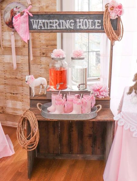 Set up a Cowgirl Party “Watering Hole” drink stand with a rustic wooden farm stand, beverage dispensers, cowgirl theme decorations and the cutest boot tumblers. 

#cowgirlparty #kidsparty #partydrinks #horseparty

#LTKkids #LTKfamily #LTKparties