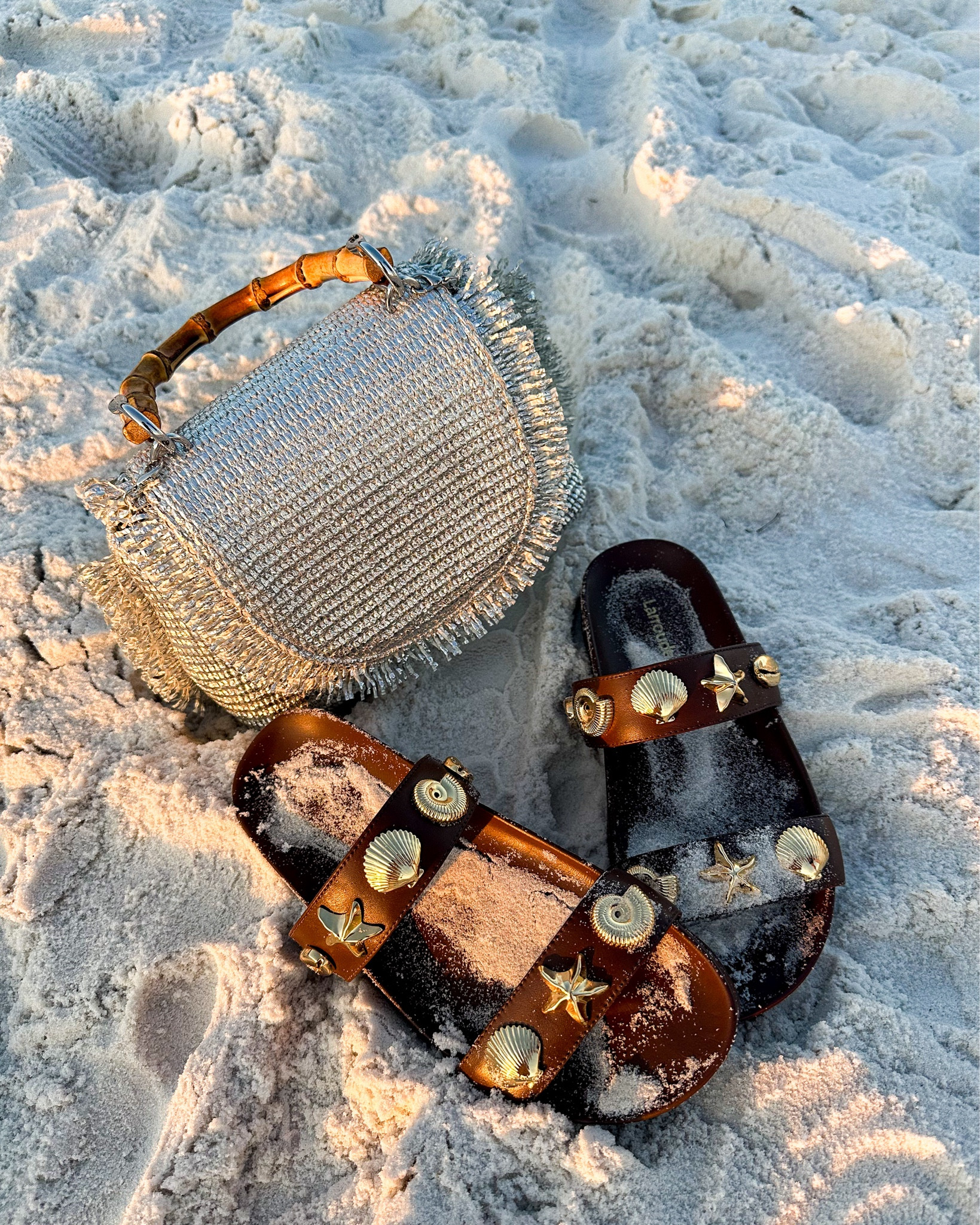 Sea shells by the sea shore! This silver raffia bag and brown leather sandals with gold seashell embellishments are my new summer identishe'll

#LTKTravel #LTKItBag #LTKShoeCrush