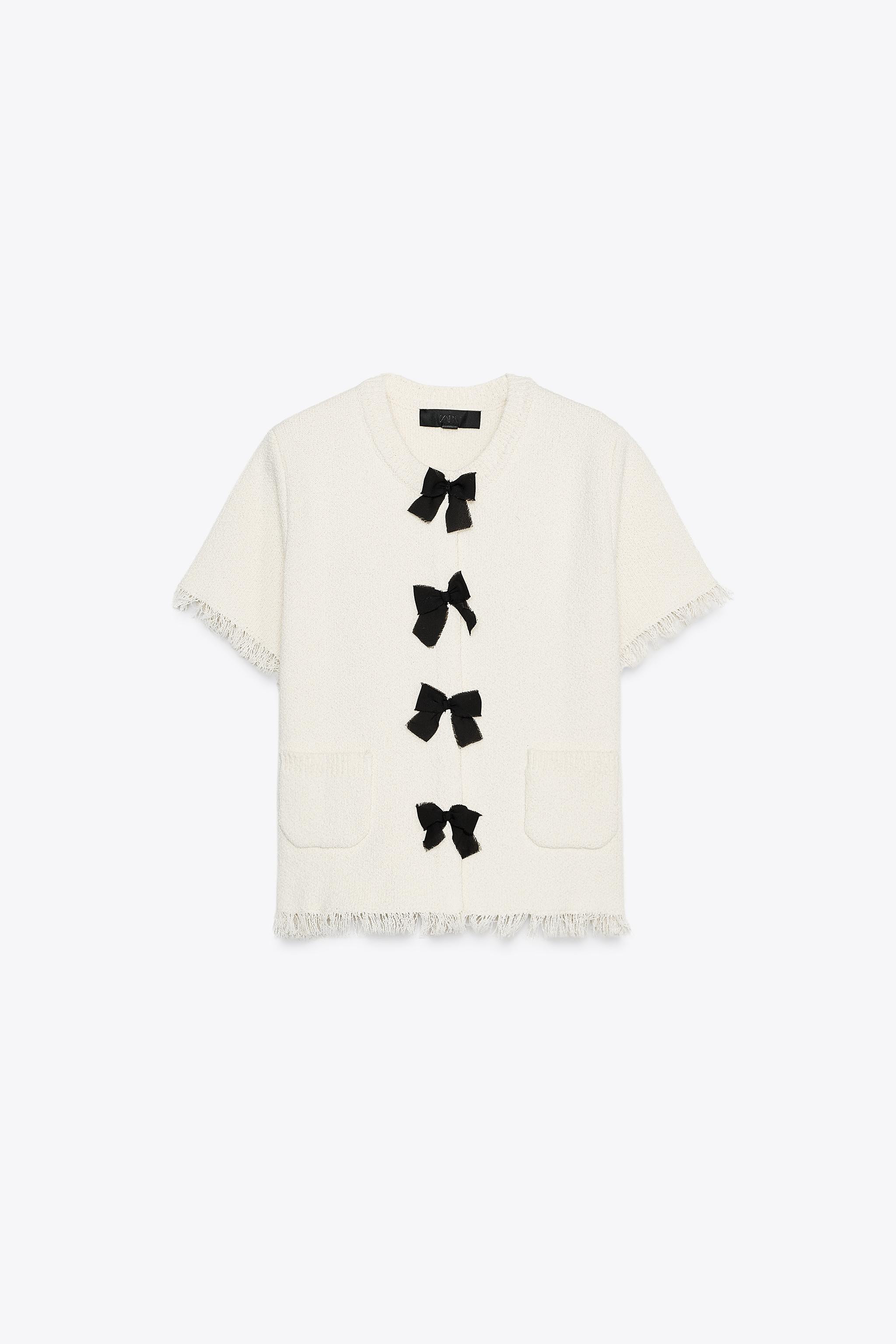 Round neck, short sleeve jacket. Front patch pockets. Contrasting front tie detail and frayed tri... | Zara US