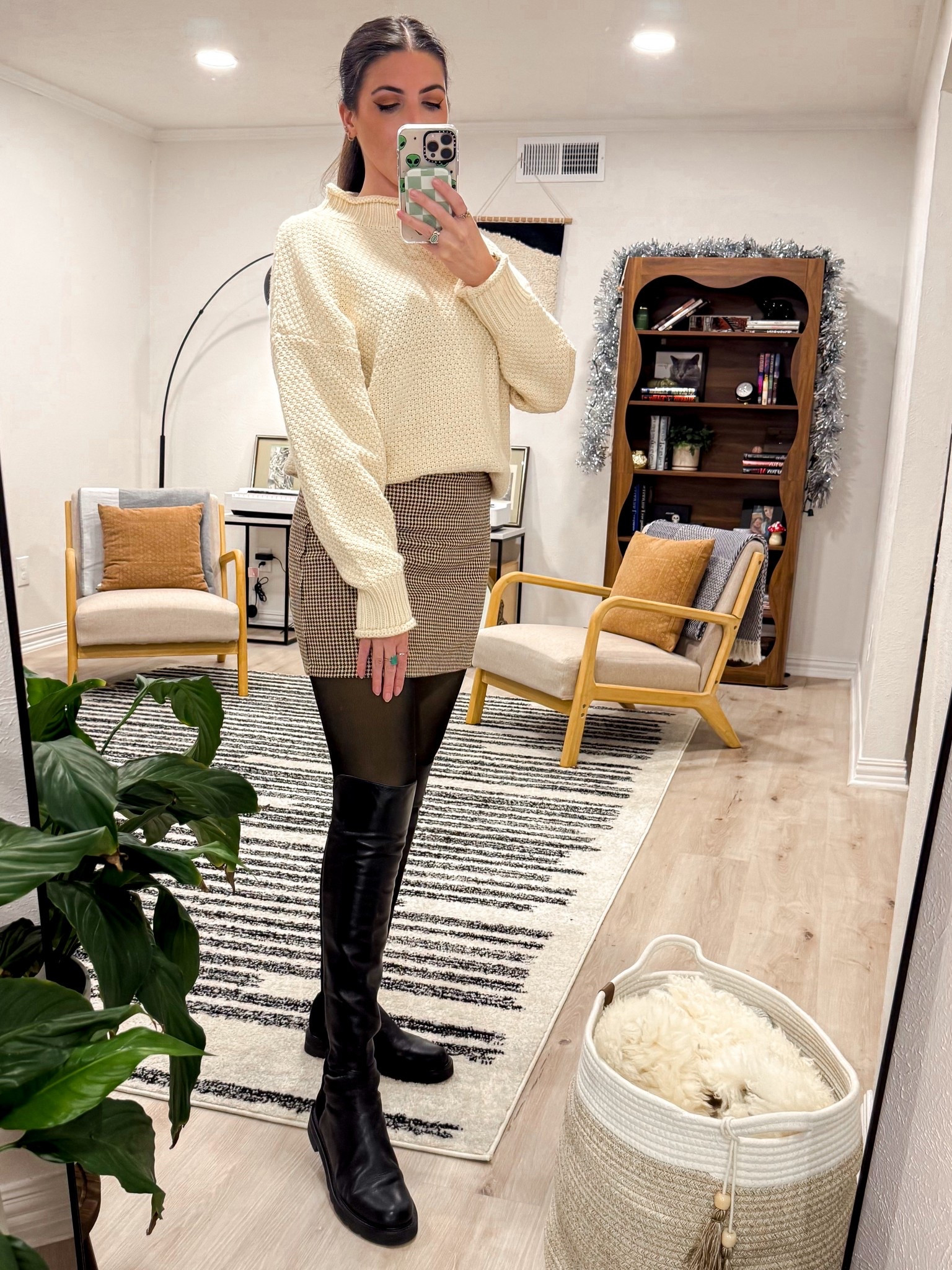 Cream knits and neutral tones never miss. The texture of the sweater paired with a structured skirt and tall boots makes this outfit feel effortless but intentional.

#LTKWorkwear #LTKootd