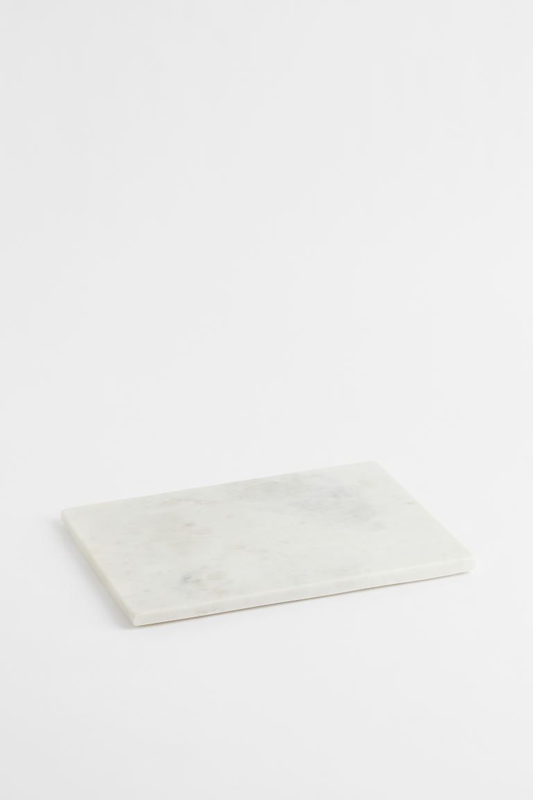 Serving board in marble with silicone feet underneath. Size approx. 1/2 x 9 3/4 x 13 3/4 in. Marb... | H&M (US + CA)