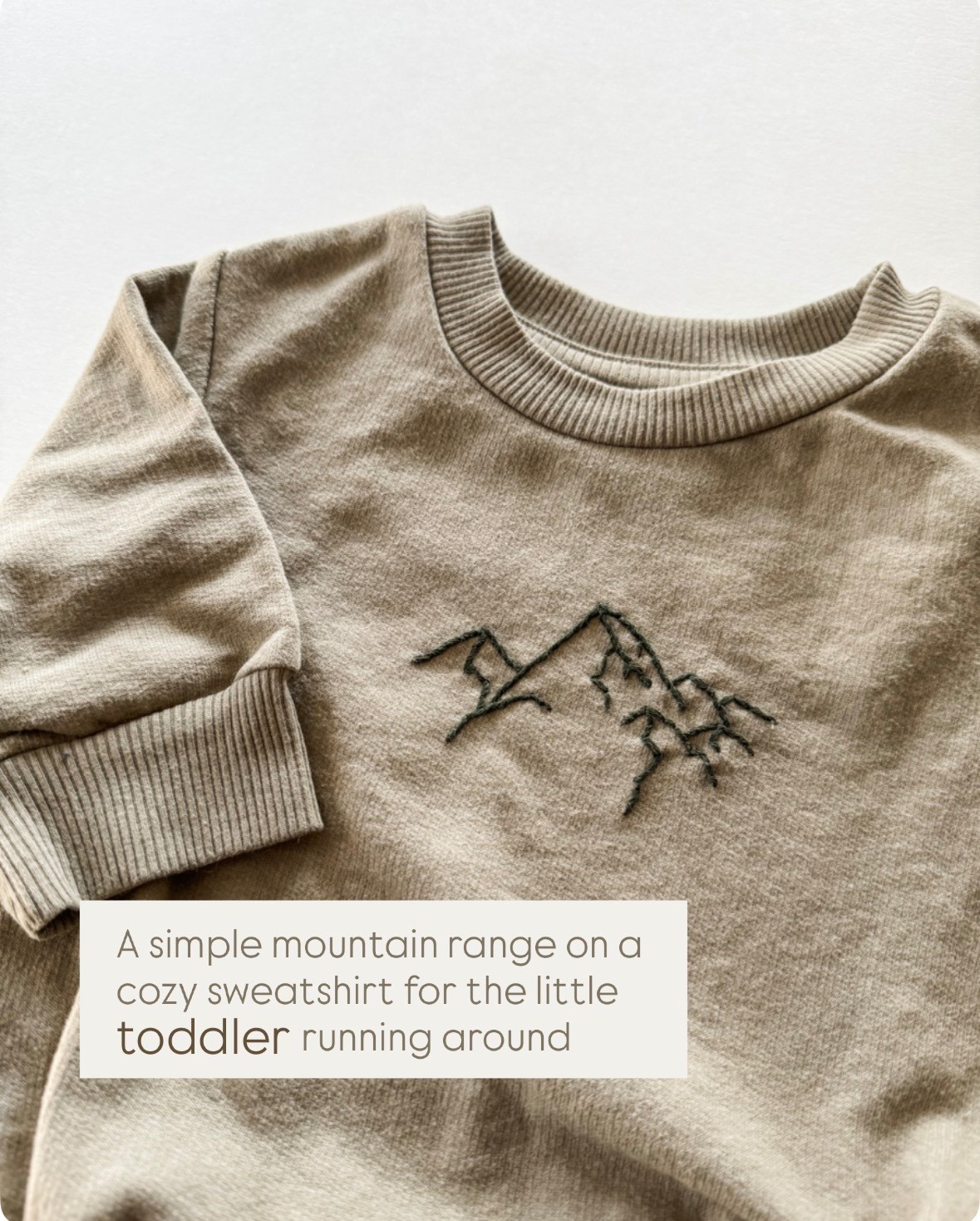 Embroidered mountain range on a sweatshirt