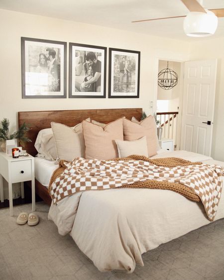 Main bedroom 🤍 fave blankets on major sale for $45! Huge and so soft/cozy. Bed frame is the best!

West elm, the styled collection, checkered blanket, cozy bedroom, cozy bed, gallery wall, black frames, bedroom decor 

#LTKhome