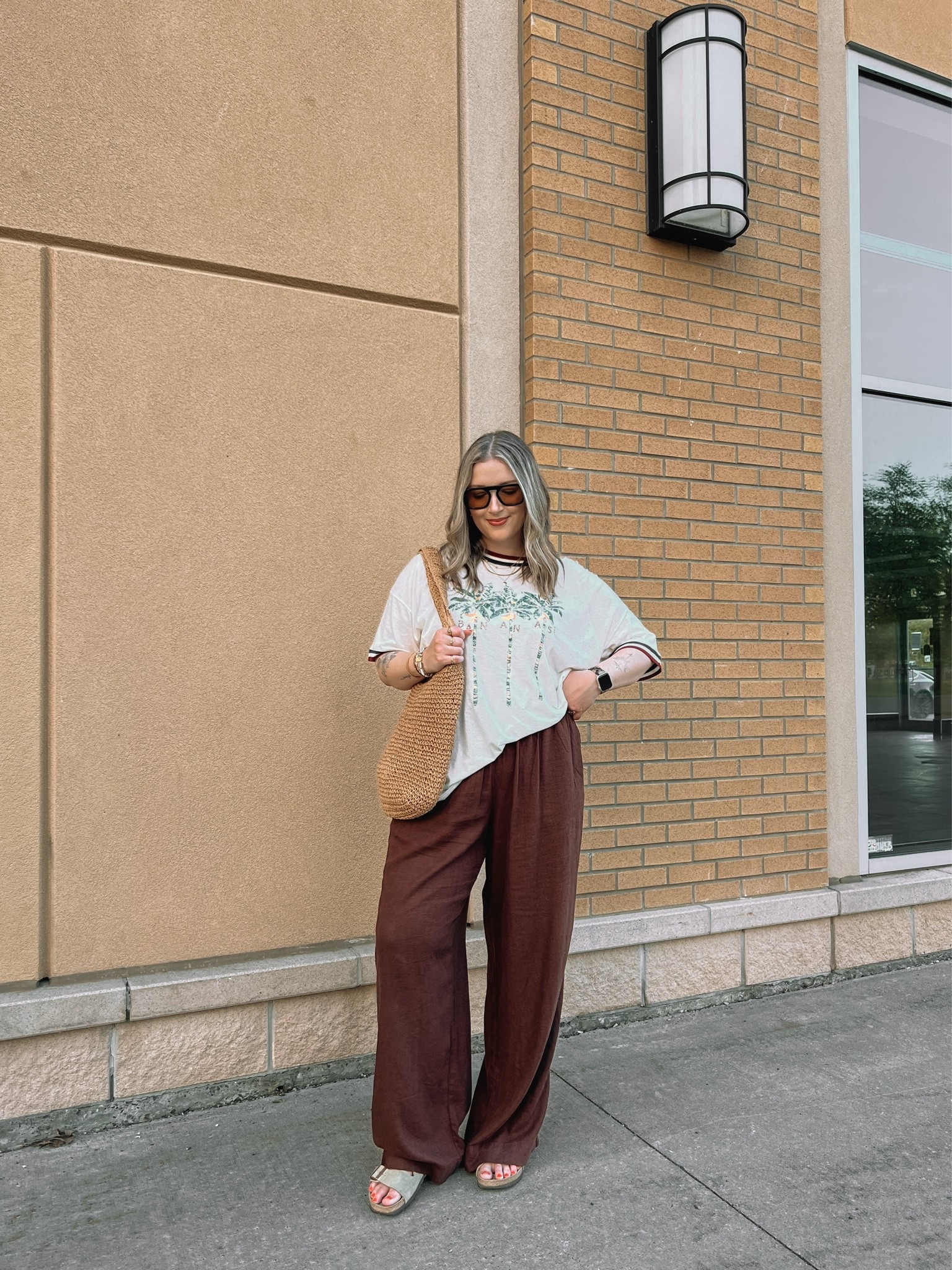 Comfy casual summer outfit! Wearing my usual size L in the graphic tee and L tall in the linen pants (Canadian pants link under “similar products”). Sunnies and straw bag are Amazon finds! Birkenstocks fit TTS

#LTKsummer #LTKsale #LTKmidsize