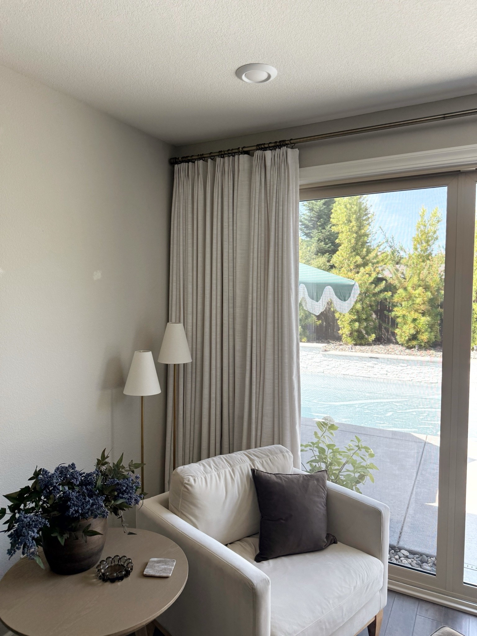 Cozy living room corner | pinch pleat curtains | curtain rod | accent chair

#LTKHome