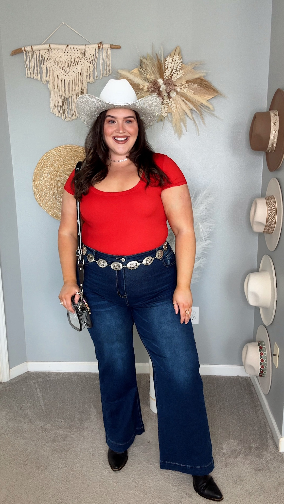 Spring outfit inspo styling closet basics. Country concert outfit inspo, scoop neck bodysuit, flare jeans, concho belt, cowgirl boots, cowboy hat ⚡️🤠☀️ 
Bodysuit: XL 
Flare denim: 16 
Hat is Official Rhinestone Cowgirl on Instagram, linked their Etsy shop as well ✨

#LTKstyletip #LTKplussize #LTKFestival