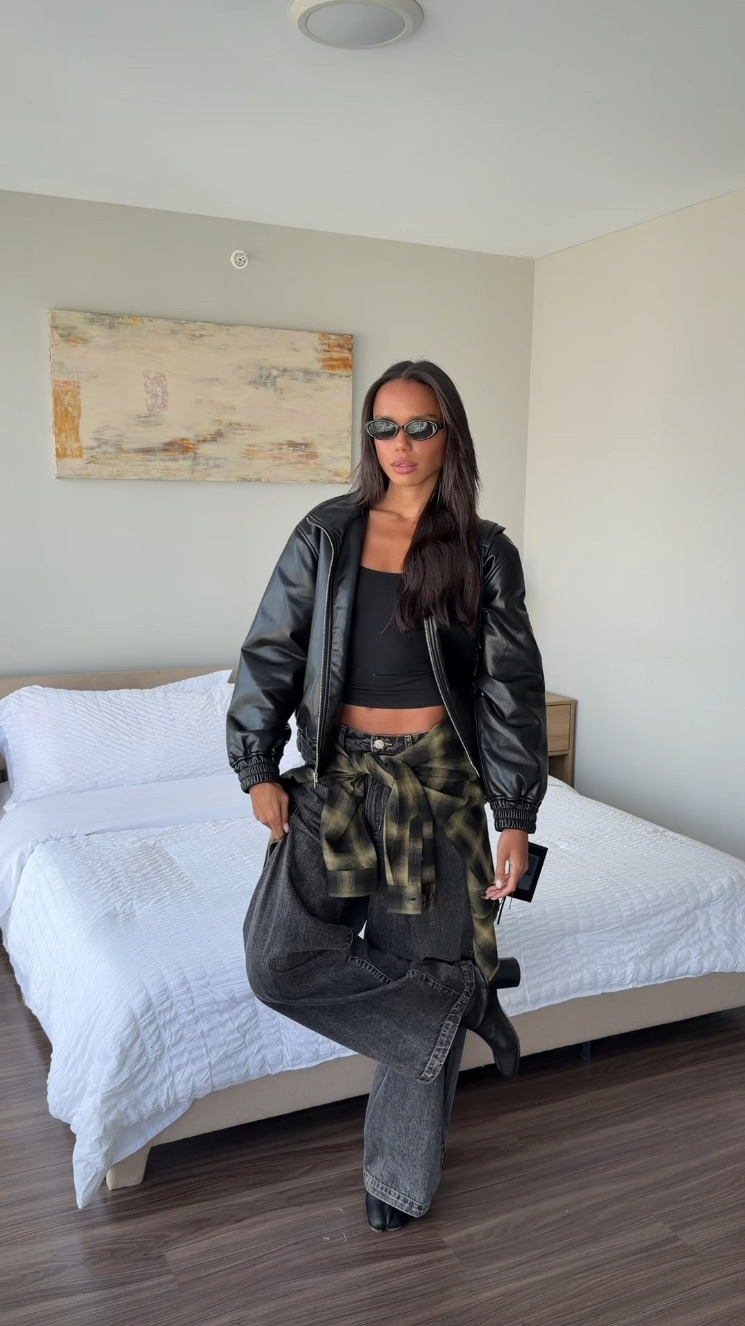 Tank is Tank Air. Plaid shirt is from Hours