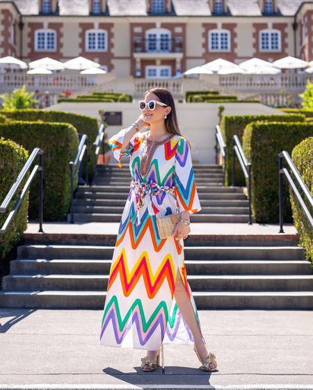 A colorful print caftan dress by Figue with a wicker clutch, white sunglasses, and gold lamé mule sandals by Loeffler Randall

#LTKSeasonal #LTKitbag #LTKstyletip