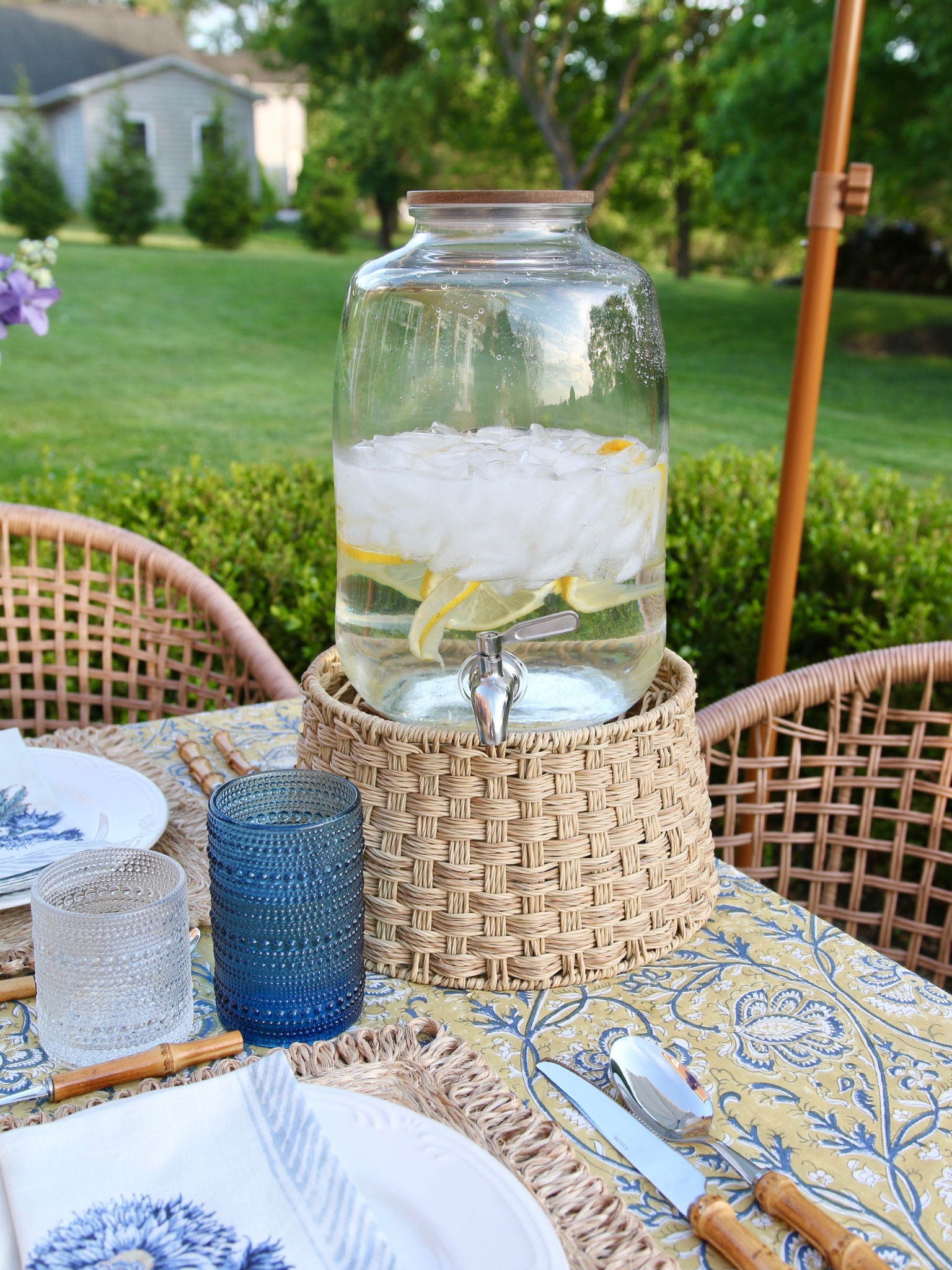 Patio decor, beaded drinking glass, block print tablecloth, cloth napkin, bamboo flatware set, woven placemat, glass beverage dispenser, rattan beverage dispenser stand

#LTKstyletip #LTKhome #LTKFind