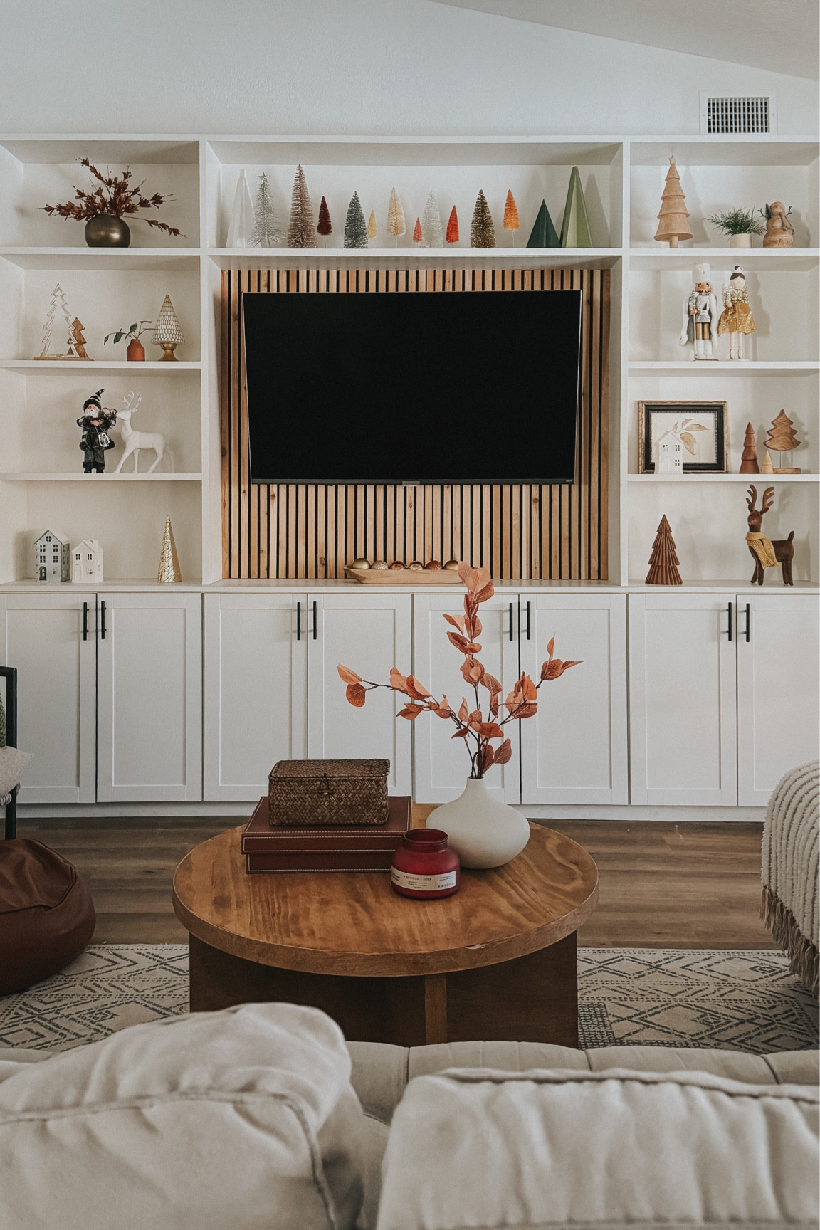 Cozy living room holiday decor. I’m loving the neutrals this year! Lots of wood tones, gold and silver  

#LTKHoliday #LTKhome #LTKSeasonal