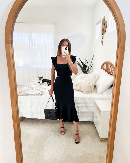 Love this black ruffle sleeve bodycon midi dress! Perfect for date night or a wedding! Hugs your curves, figure-flattering, & has a comfortable stretch.

// black dress, date night outfit, date night dress, wedding guest dress, black tie, cocktail dress, spring dress, midi dress, vacation outfit, vacation outfits, summer dress, summer dresses, summer outfits 2023, summer wedding guest dress, summer outfit, summer outfits, vacay, resort wear, neutral style, sandals, quilted purse, Petal and Pup, Target, Dolce Vita #LTKFind #LTKitbag #LTKshoecrush #LTKstyletip #LTKunder50

#LTKunder100 #LTKSeasonal #LTKwedding
