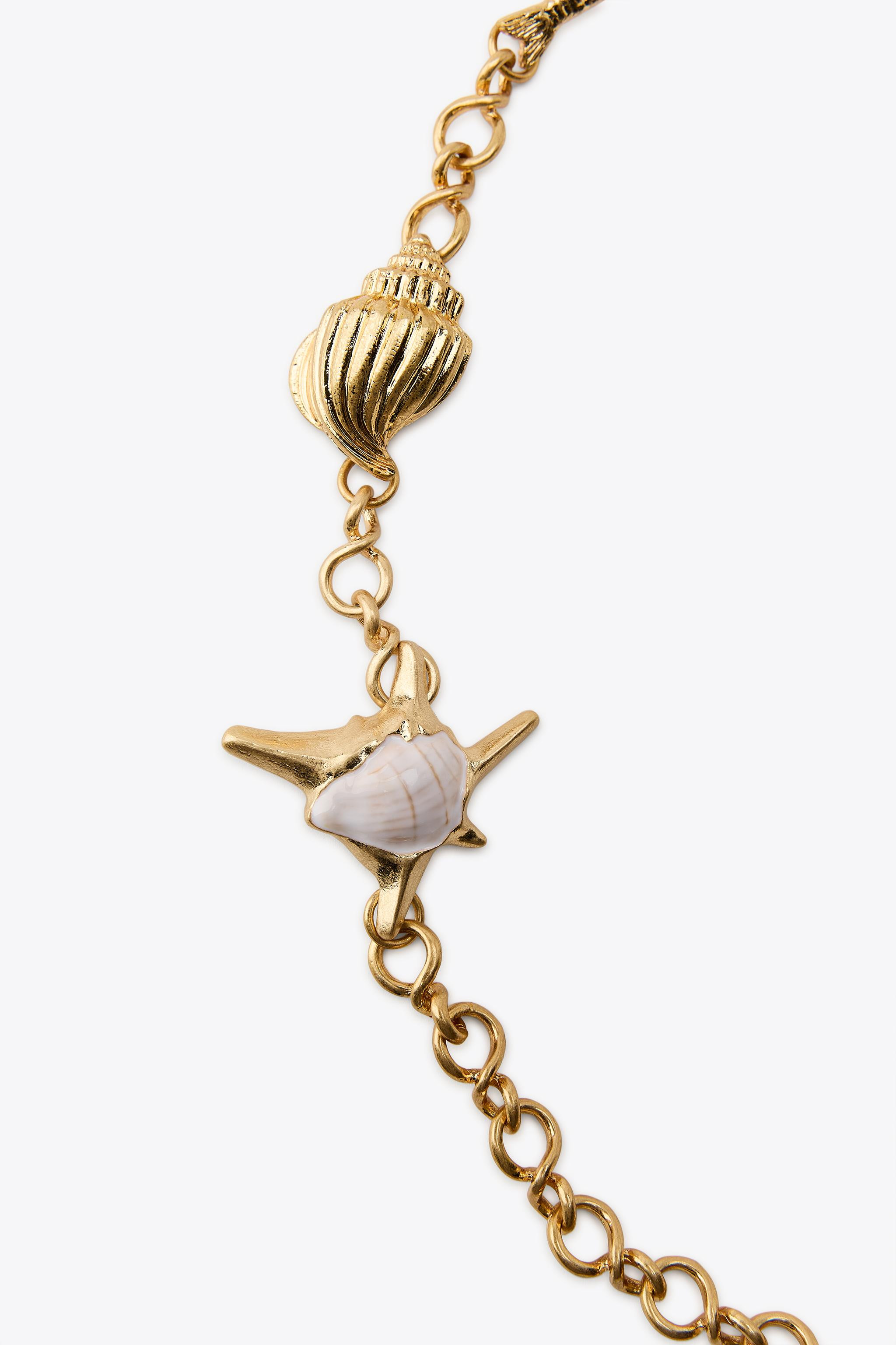 Metal link chain belt. Nautical charms in different shapes and sizes. Lobster clasp fastening. | Zara UK