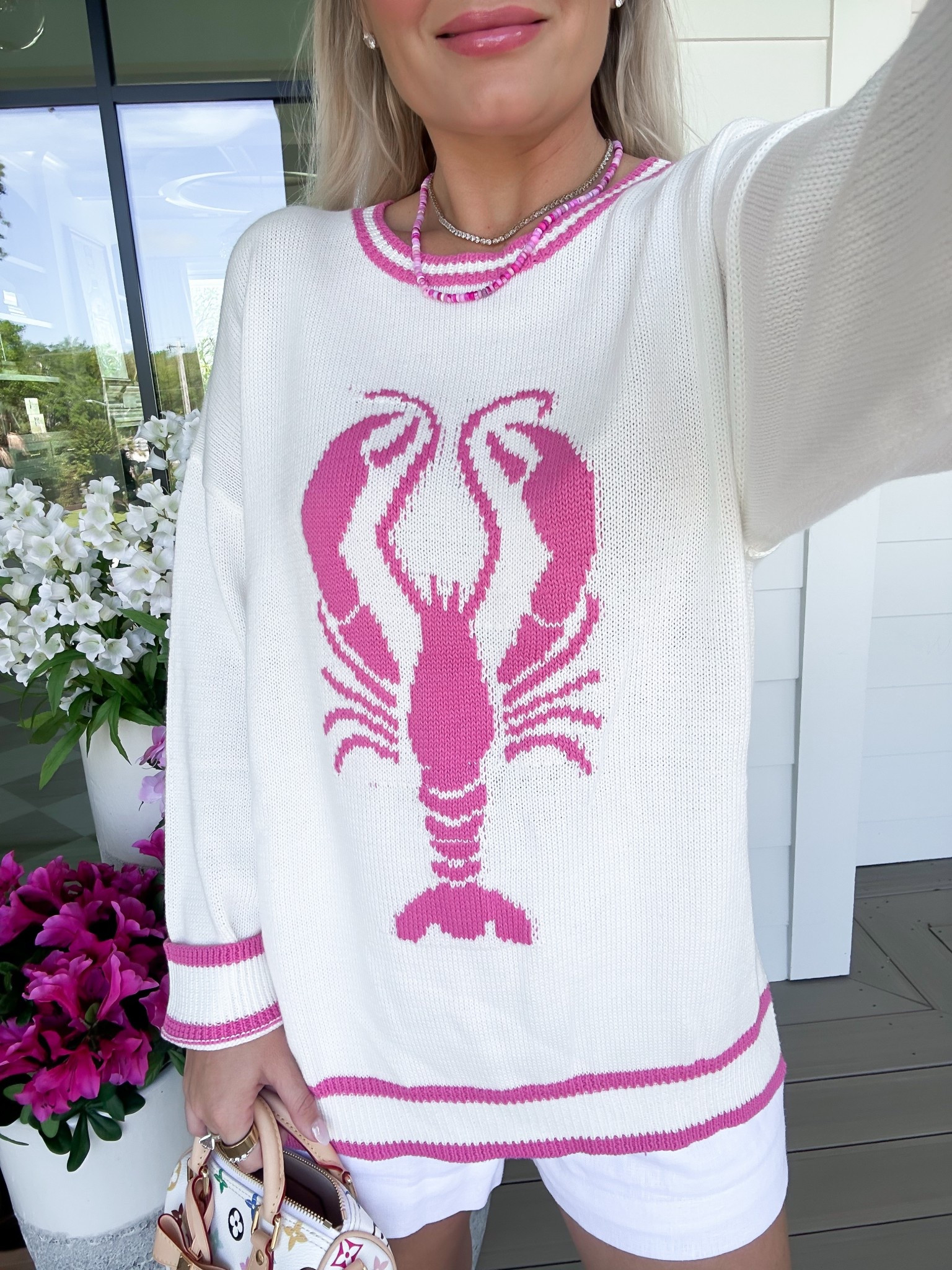 Vacation style 🩷 love this lobster sweater. Wearing size small. Use code Whitney for discount! 

#LTKFindsUnder50 #LTKTravel #LTKSeasonal