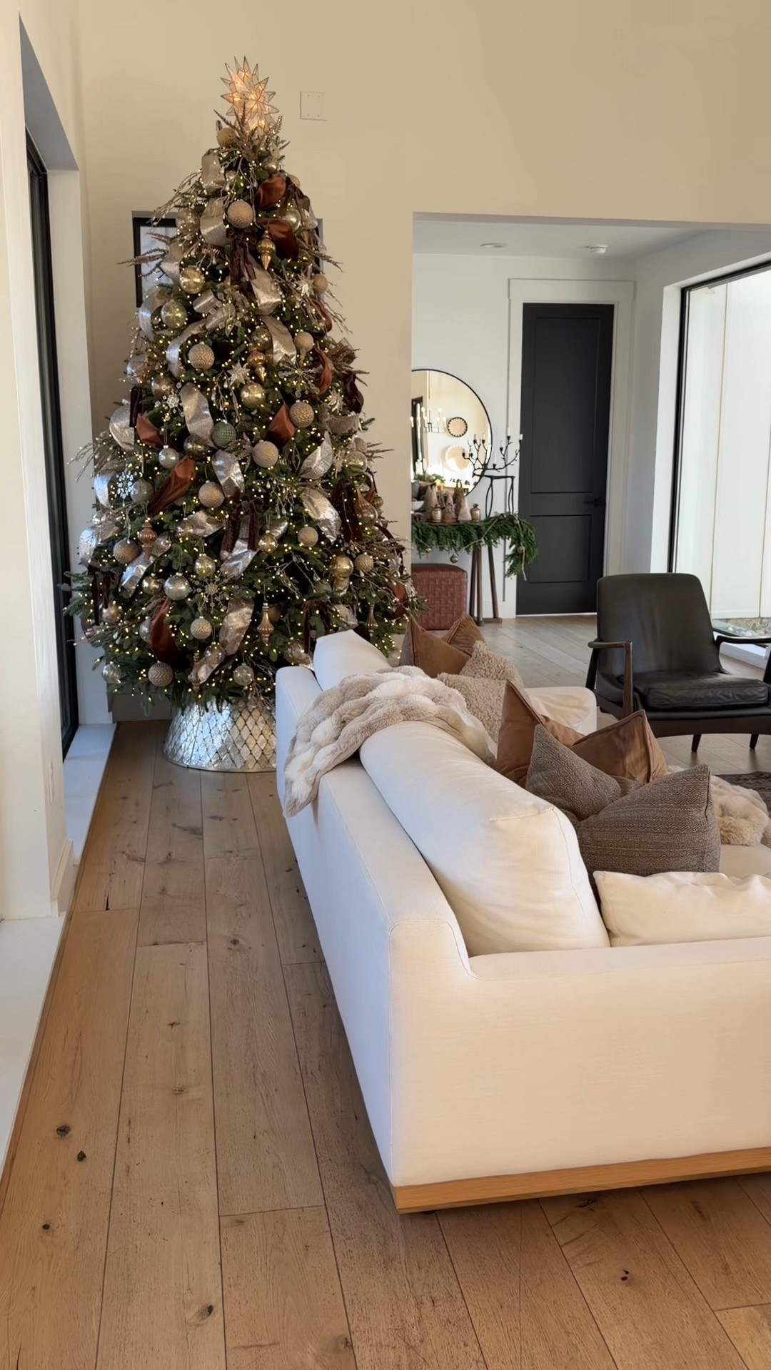 Cozy, layered, and officially in full Christmas mode. Our living room is where we slow down this season — tree lights on before sunrise, blankets piled high, pine + ribbon everywhere, and the soft glow of metallic ornaments tucked throughout the room. It’s warm, classic, and a little bit magical.

From the vintage-washed Loloi rug, boucle + leather seating, oversized pillows and throws, natural greenery, and our wood coffee table stacked with simple holiday accents — everything in here is meant to feel lived-in and loved through December.

If you’re decorating or refreshing your home for the holidays, I linked the key pieces below.

holiday living room decor, modern Christmas living room, cozy Christmas style, neutral holiday decor, Loloi rug living room, boucle accent chairs, Christmas tree styling, warm neutral Christmas home, layered holiday textures, natural greenery Christmas interiors


#LTKSaleAlert #LTKHome #LTKHoliday