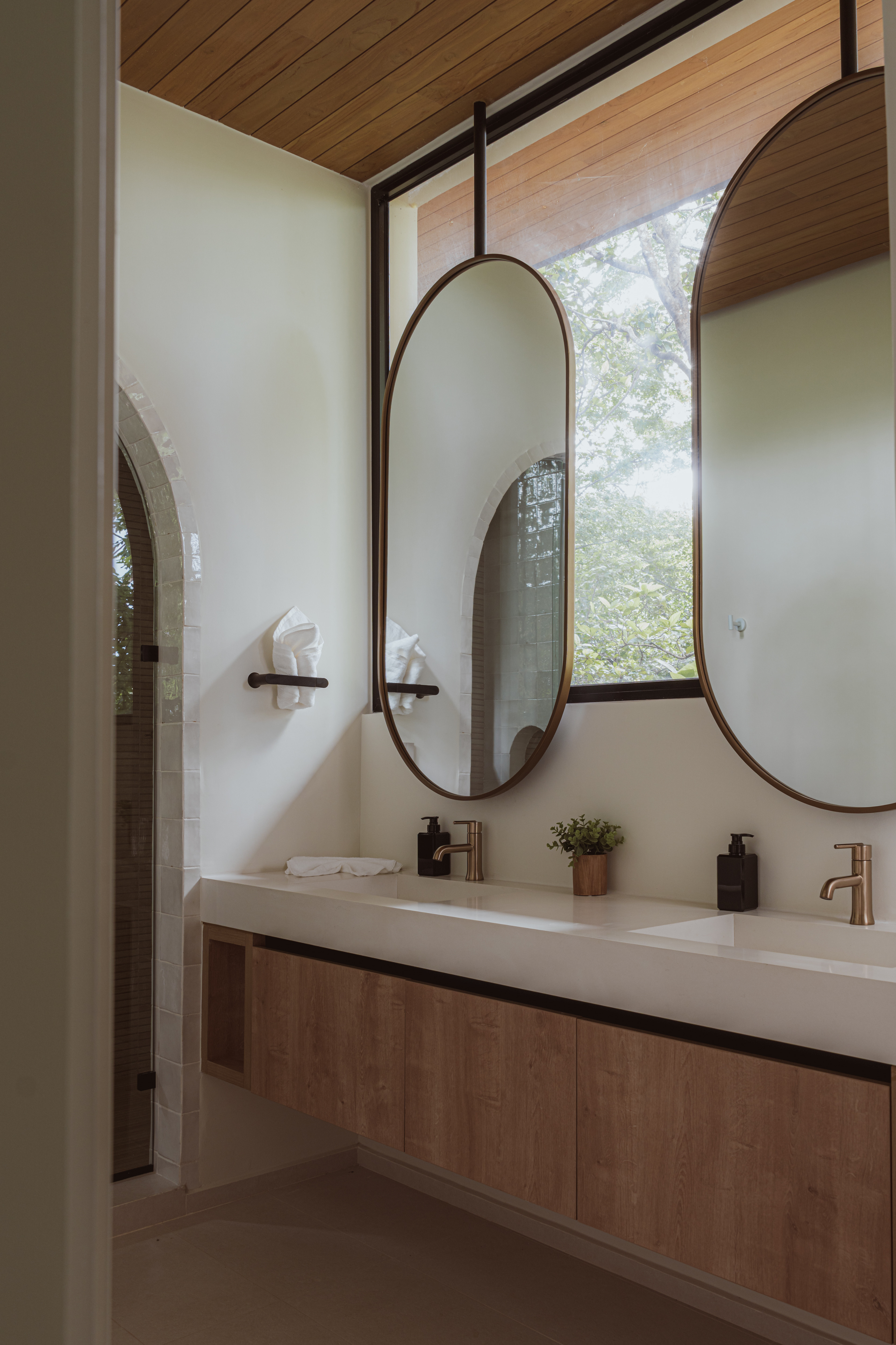  

Arches around every corner, floating mirrors with jungle views, and those dreamy Zellige Perla tiles from Floor & Decor — all in the primary bathroom at Villa Nya. 🌴✨
 
#interiordesigner #bathroom #bathroomdesign #architecture 