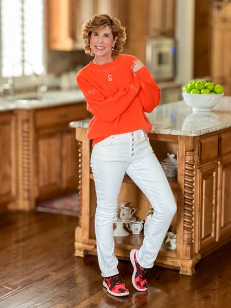 Wearing an orange sweater is a great way to transition from winter to spring! It’s such a lively, vibrant color! I paired mine with white jeans (wear them year round) and a fun pair of sneakers (now sold out).

Take 15% off this oversized sweater with the code SUZY15.

#LTKSeasonal #LTKover40 #LTKfindsunder50