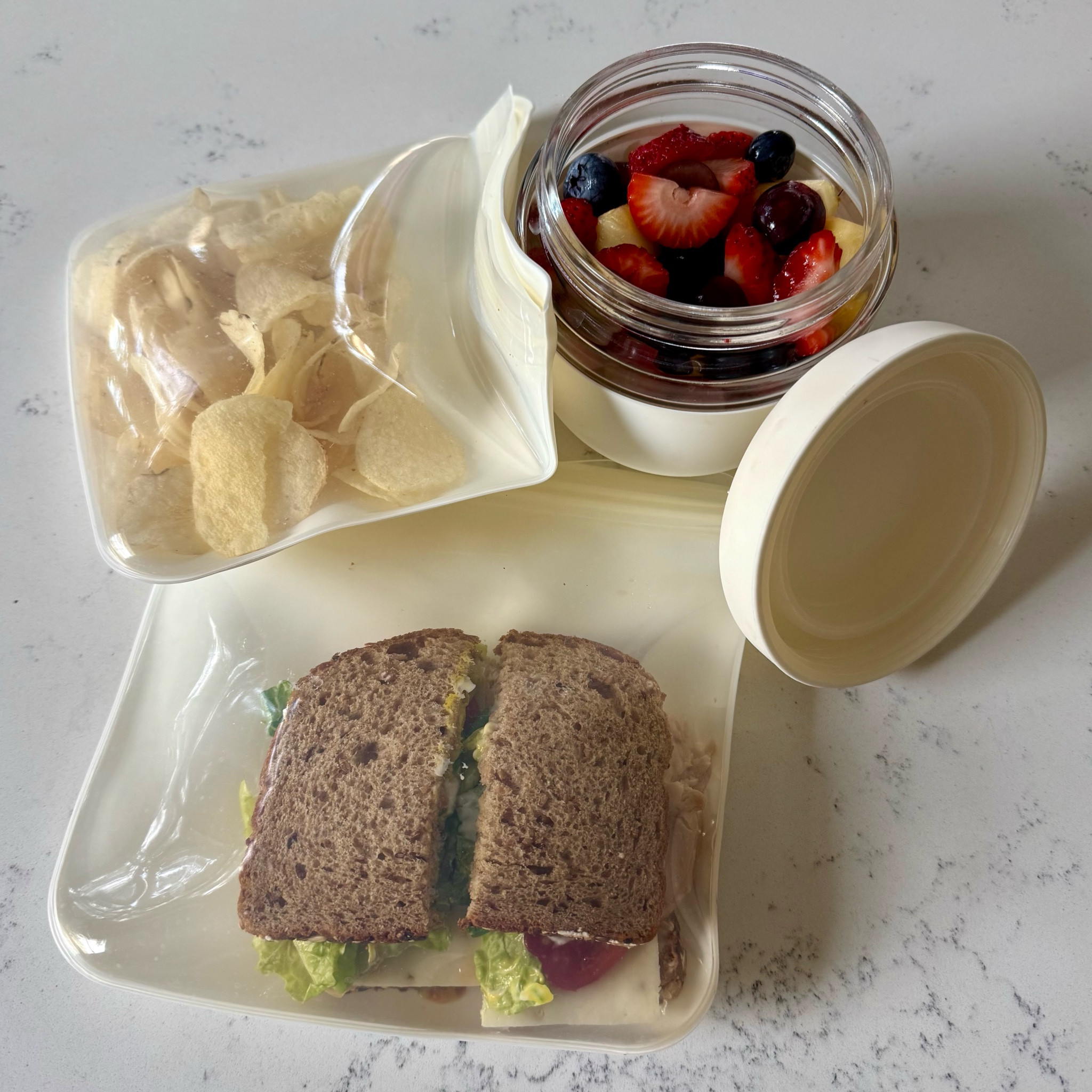here's my go to snack for school days :) 🥪🍓🫐
these reusable w&p silicone bags and container from wp are perfect for packing lunches or favorite little snack. 

i'm in love with the clean and neutral colors they come in as well😏🤍

#LTKFindsUnder50 #LTKGiftGuide #LTKHome