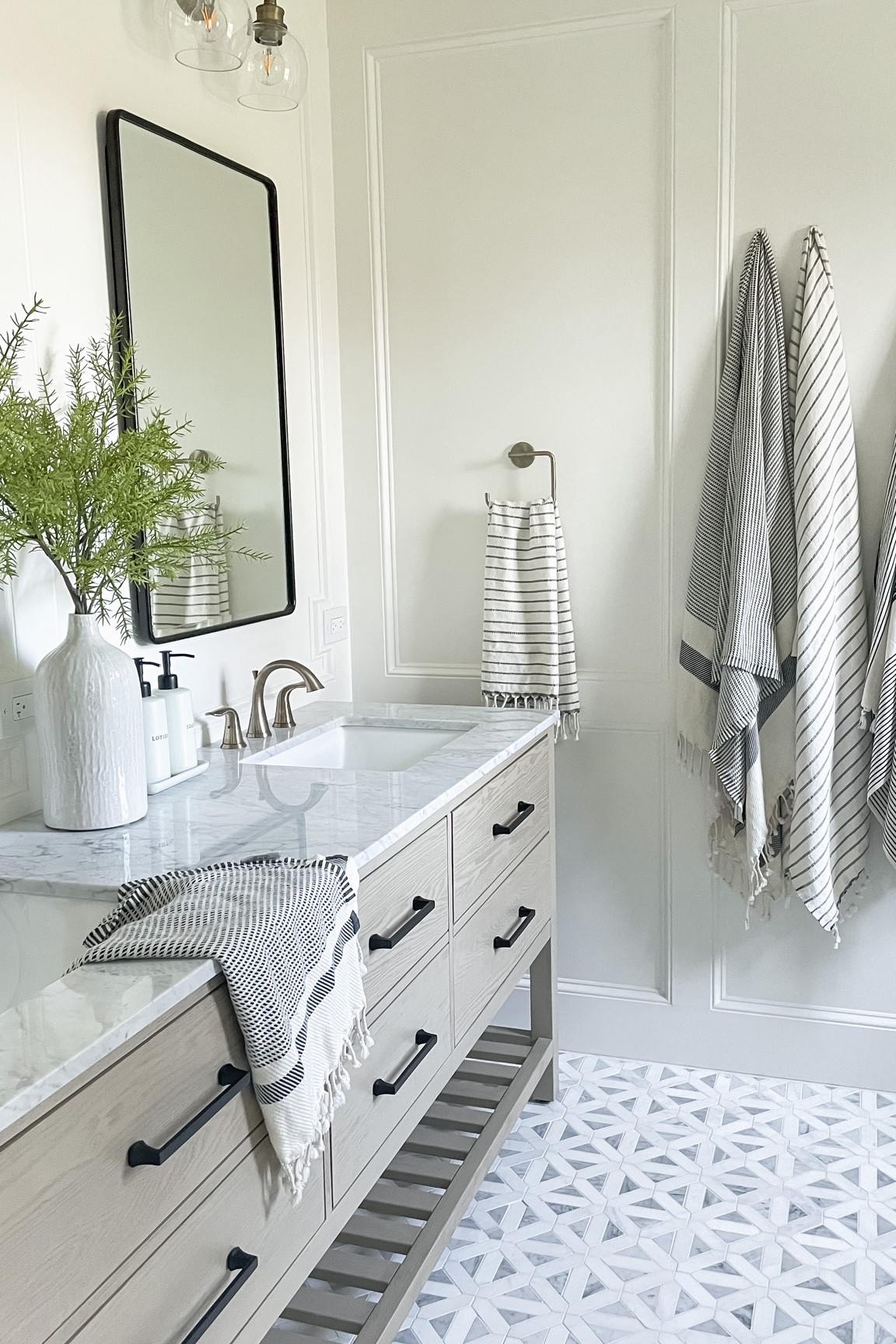 Bathroom design. Marble tile. Turkish towels. Recessed medicine cabinet. Bathroom faucet. Drawer handles. Soap dispenser. Lotion dispenser  

#LTKhome #LTKsalealert