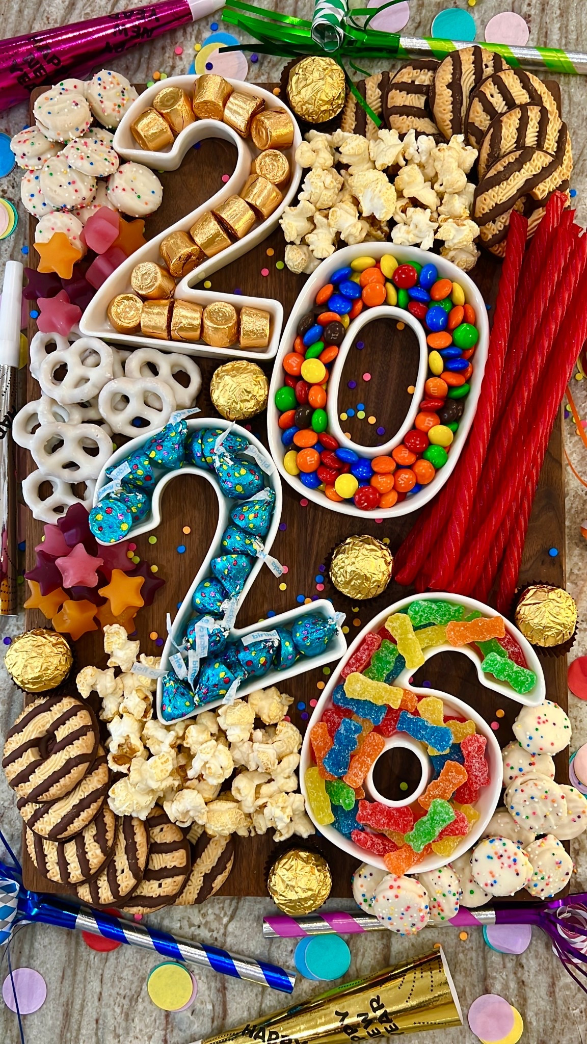 Ring in the New Year with a 2026 Sweets Board, complete with your family’s favorite chocolates, candies, popcorns and cookies!

#LTKfoodie #LTKSeasonal #LTKHoliday